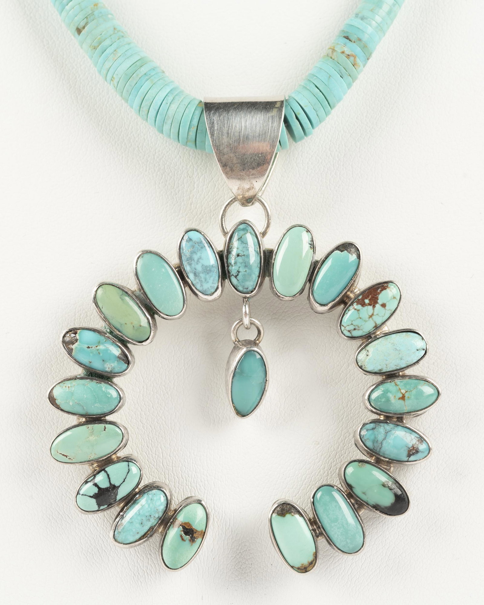 Gilo & Grace Nakai Silver & Turquoise Necklace: Naja with Gilo & Grace Nakai and "Sterling" mark on heishi beaded chain. 17" long. Naja 2-1/4".