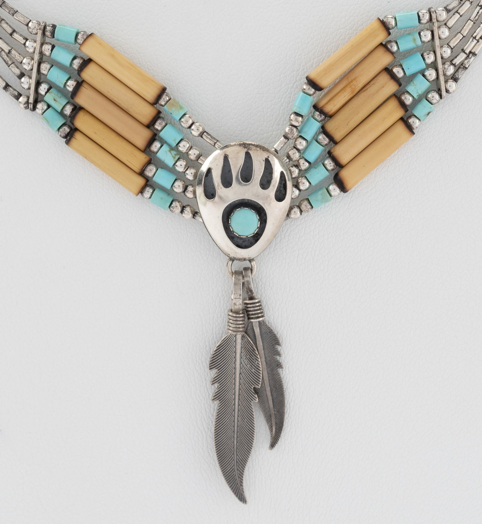 Turquoise Beaded Bear Track Choker: With feather decoration. 19-1/4" long (adjustable). Top with feathers 2".
