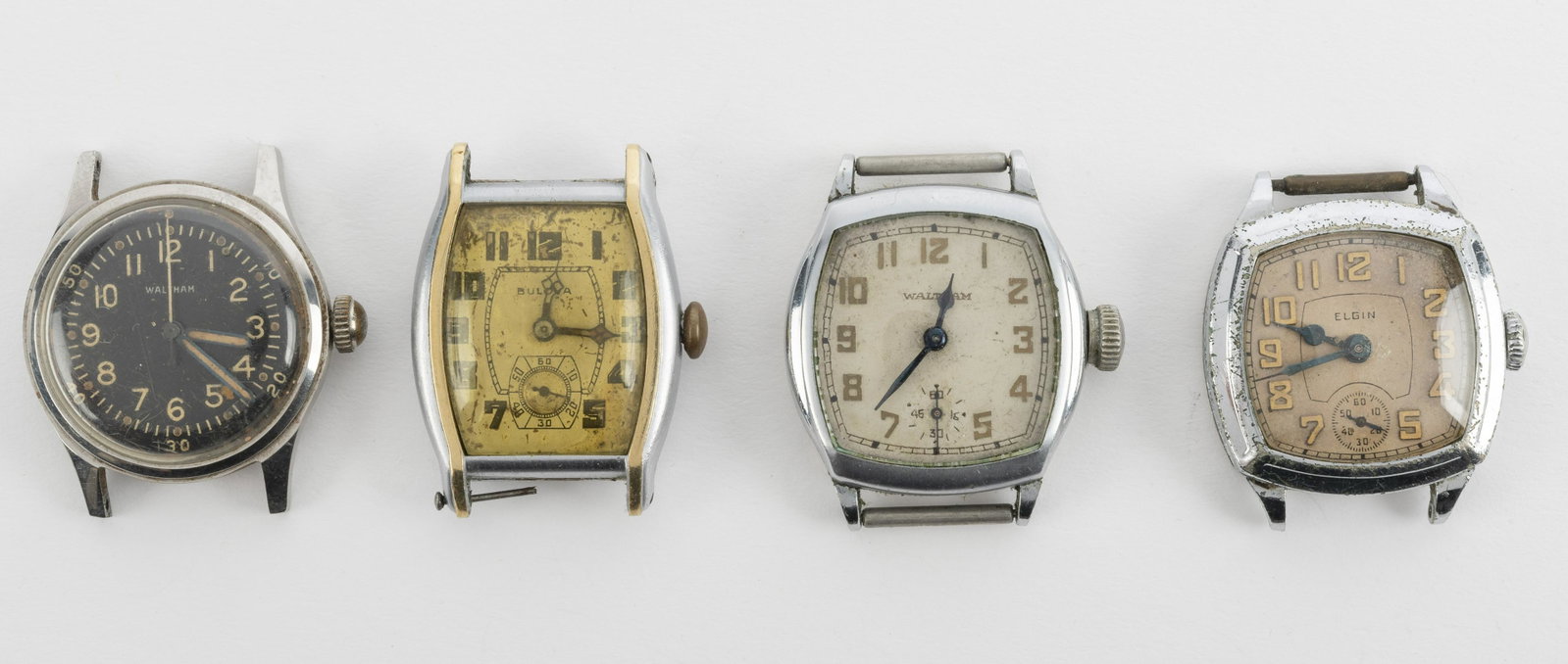 4 Vintage Wrist Watches: incl Bulova, Elgin, Waltham. Round watch 1-1/4" diameter. None running.