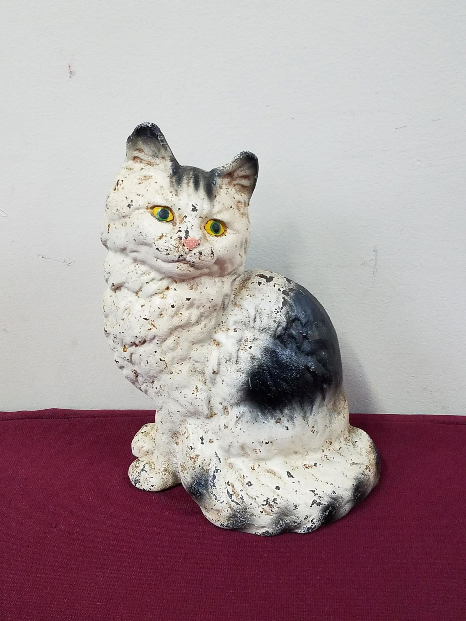 Cast Iron Door Stop: 6" wide x 8-1/2" high. Some paint losses.