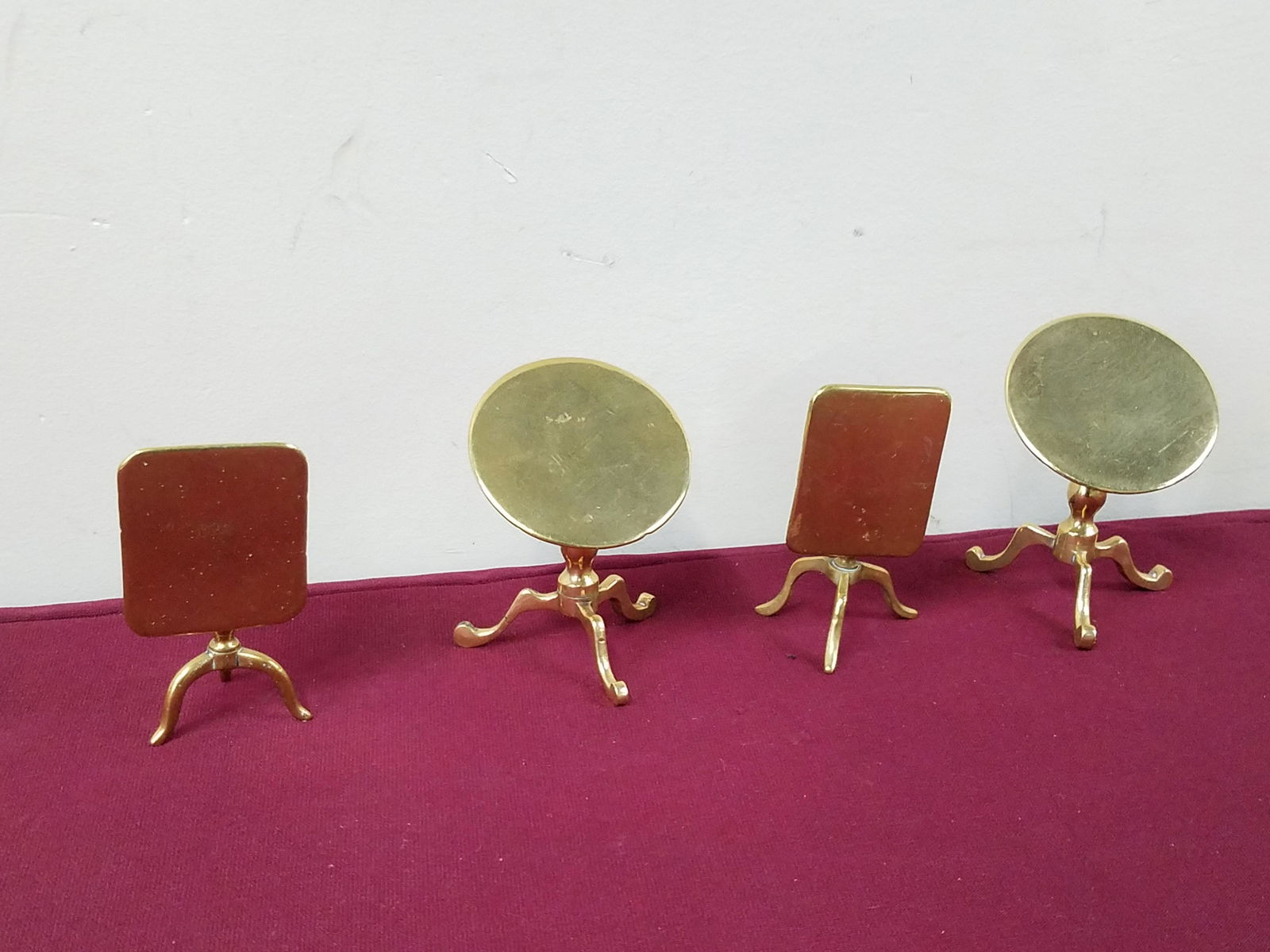 3 Miniature Brass Tilt Top Tables: 2-1/4" to 2-3/4" wide x 2-1/2" to 3-1/4" high.