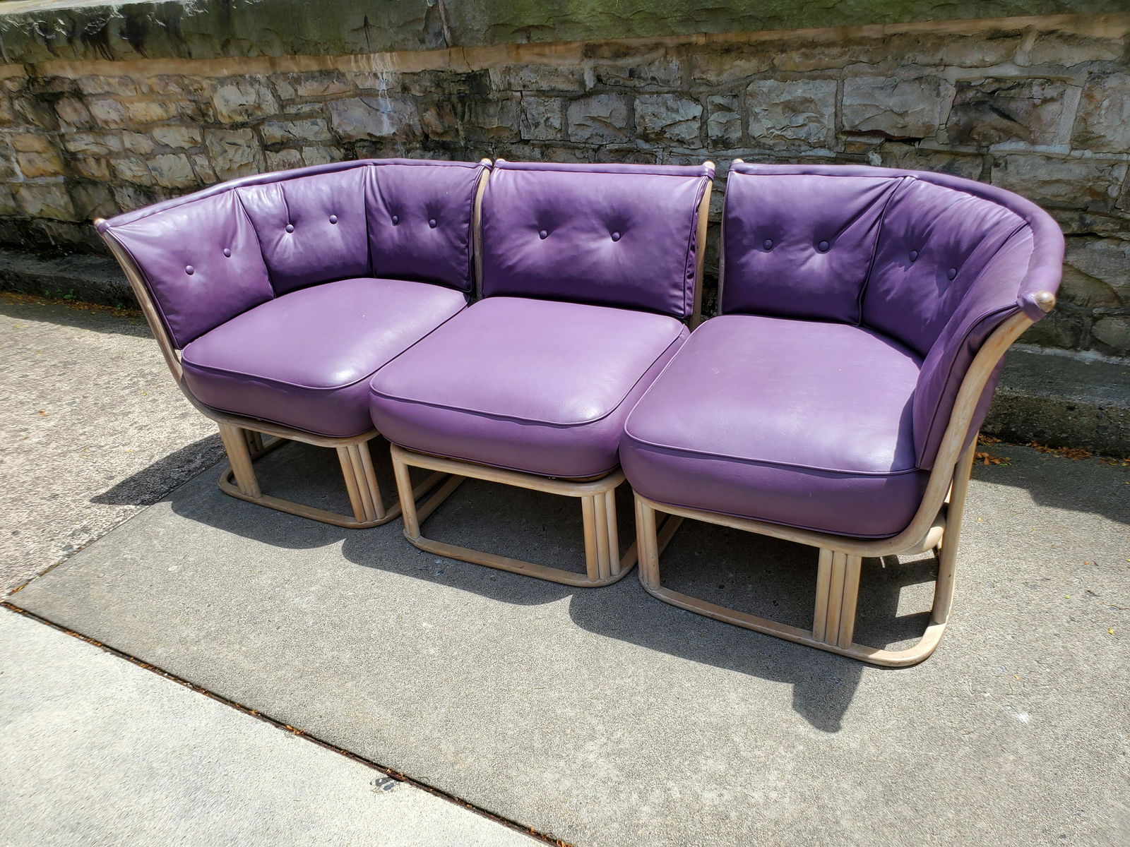 Purple Rattan Leather Sectional: 81" wide X 28" deep X 29" high. Some scuffing to rattan. IMPORTANT: Before bidding, please read the terms and conditions below. When you registered for the auction you agreed to these terms and will b