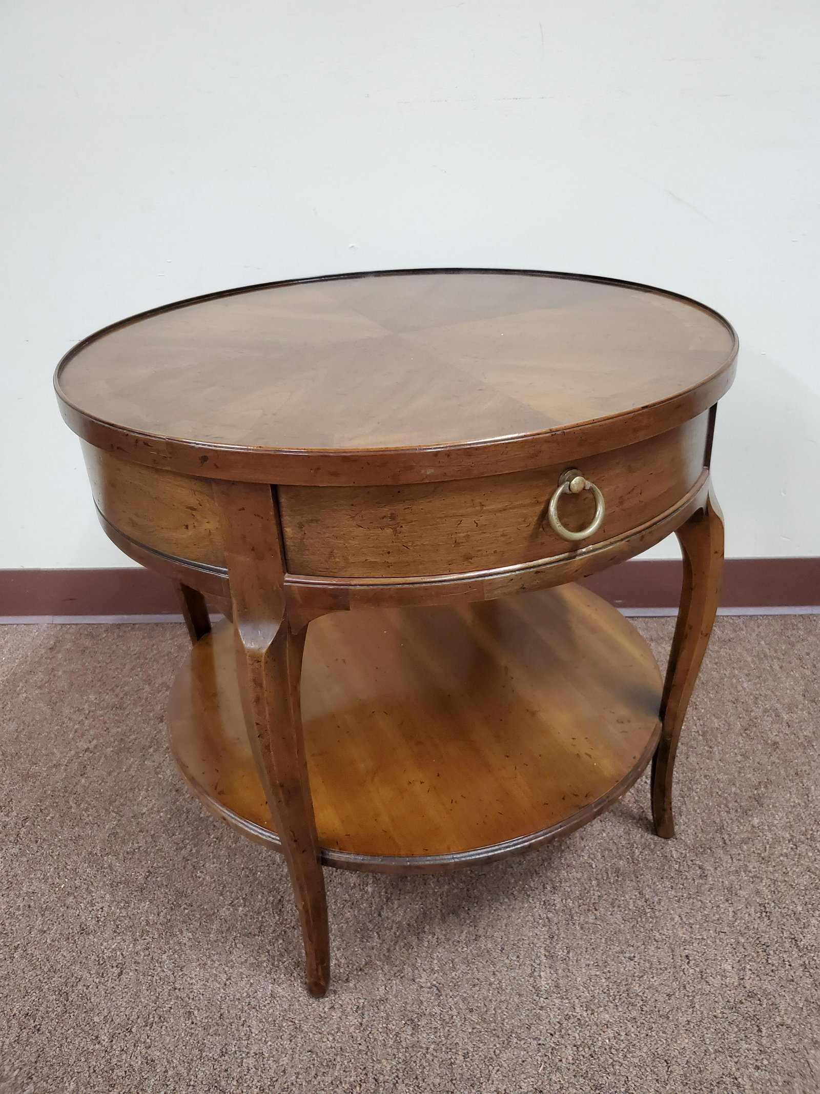 Heritage Round Side Table: 24" wide X 22" high. IMPORTANT: Before bidding, please read the terms and conditions below. When you registered for the auction you agreed to these terms and will be required to comply with them.