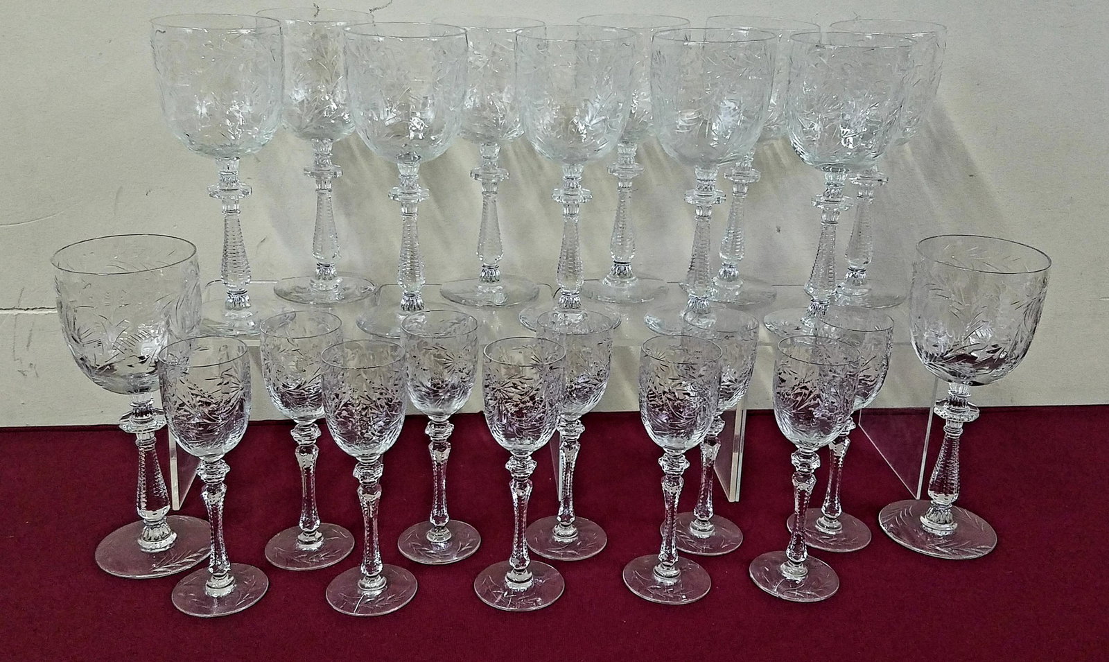 22 Crystal Water and wine Glasses: 6-1/4" to 8" high. 3 wine glasses with chipped base. IMPORTANT: Before bidding, please read the terms and conditions below. When you registered for the auction you agreed to these terms and will be re
