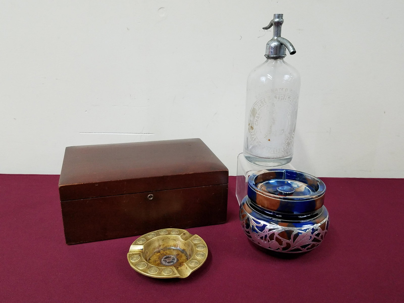 Humidors, Ash Tray and Phillips Bros Seltzer: Philadelphia Rifle Club ashtray marked Philadelphia Schutzen-Verein 1921. Sterling overlay humidor. Seltzer bottle with etched boxers. 3/4" to 10-3/4" high. Wooden humidor: 11-1/4" wide x 7-3/4" deep 