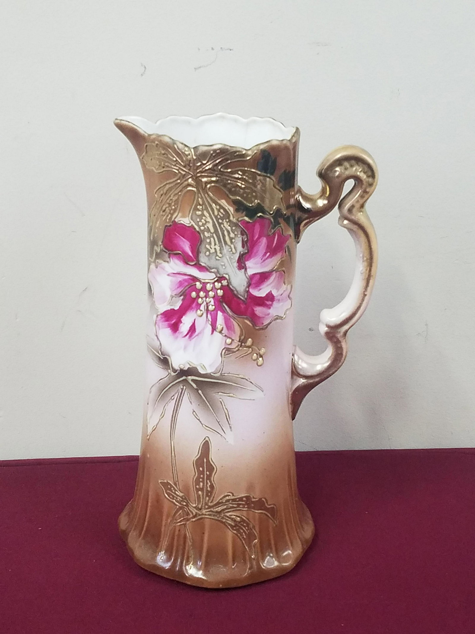 Nippon Pitcher: 6" diameter x 12-1/2" high. Hairline crack. IMPORTANT: Before bidding, please read the terms and conditions below. When you registered for the auction you agreed to these terms and will be required to