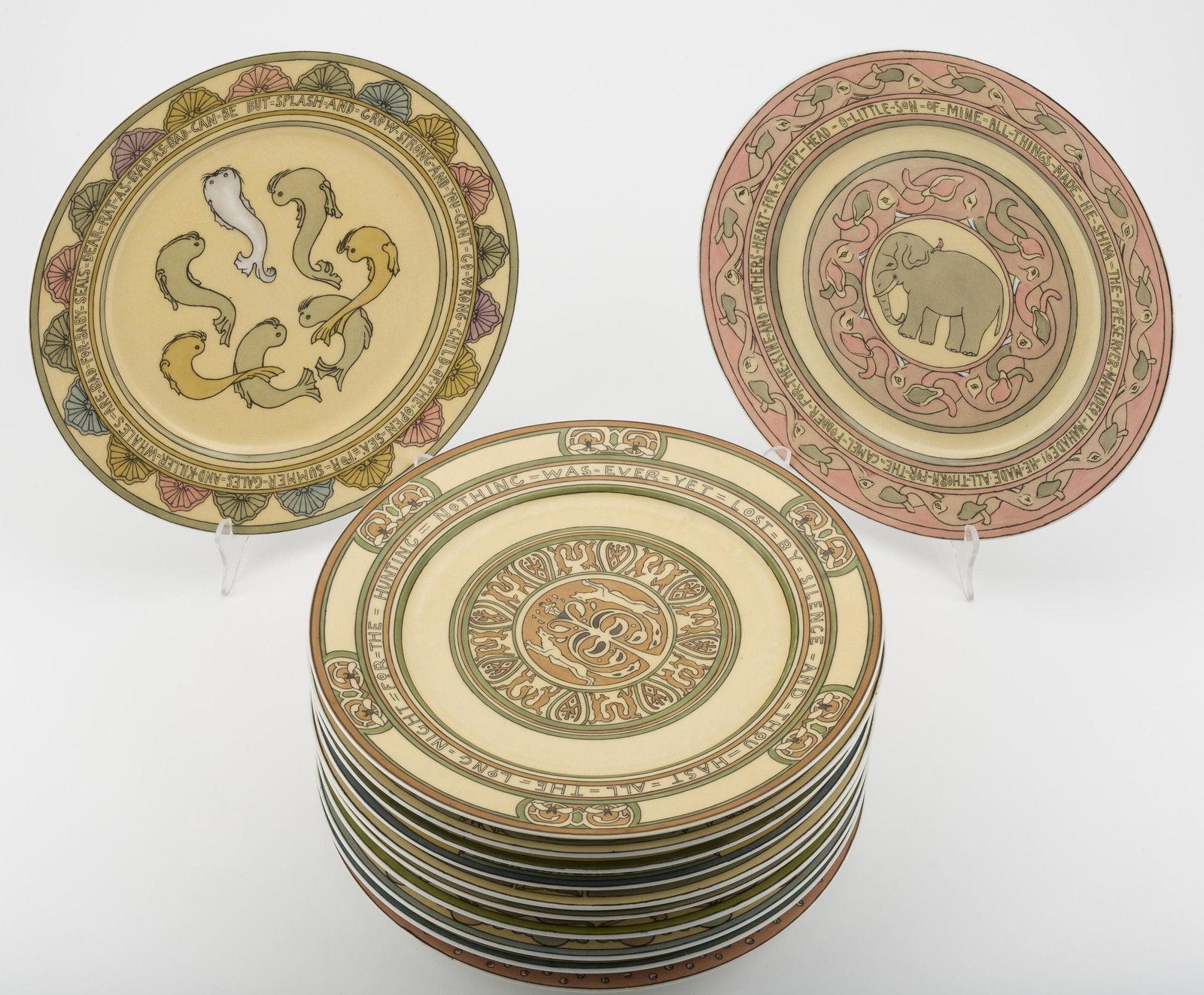 12 Guerin Limoges Mary Bacon Jones Plates: DESCRIPTION: Twelve Wm. Guerin & Co. Jungle Book series plates. Also called Jungle Folk and Kipling Plates. Designed and copyrighted by Mary Bacon Jones. Circa 1905. Marked on bottom with Guerin hallm