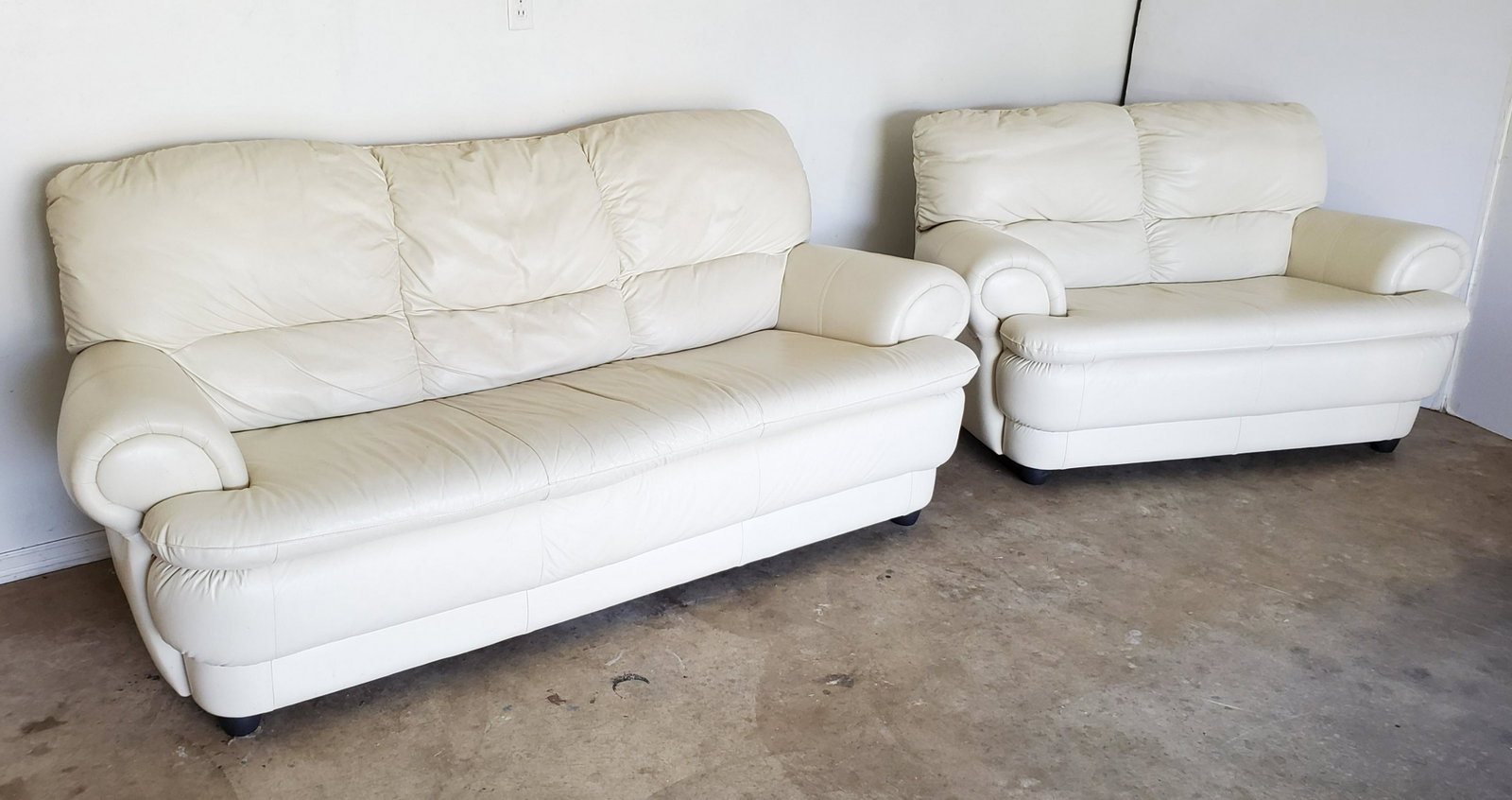 White Leather Sofa and Love Seat: Sofa 81" wide X 38" deep X 34 1/2" high. Love seat 57 1/2" wide X 38" deep X 32 1/2" high. Some signs or wear. IMPORTANT: Before bidding, please read the terms and conditions below. When you registere