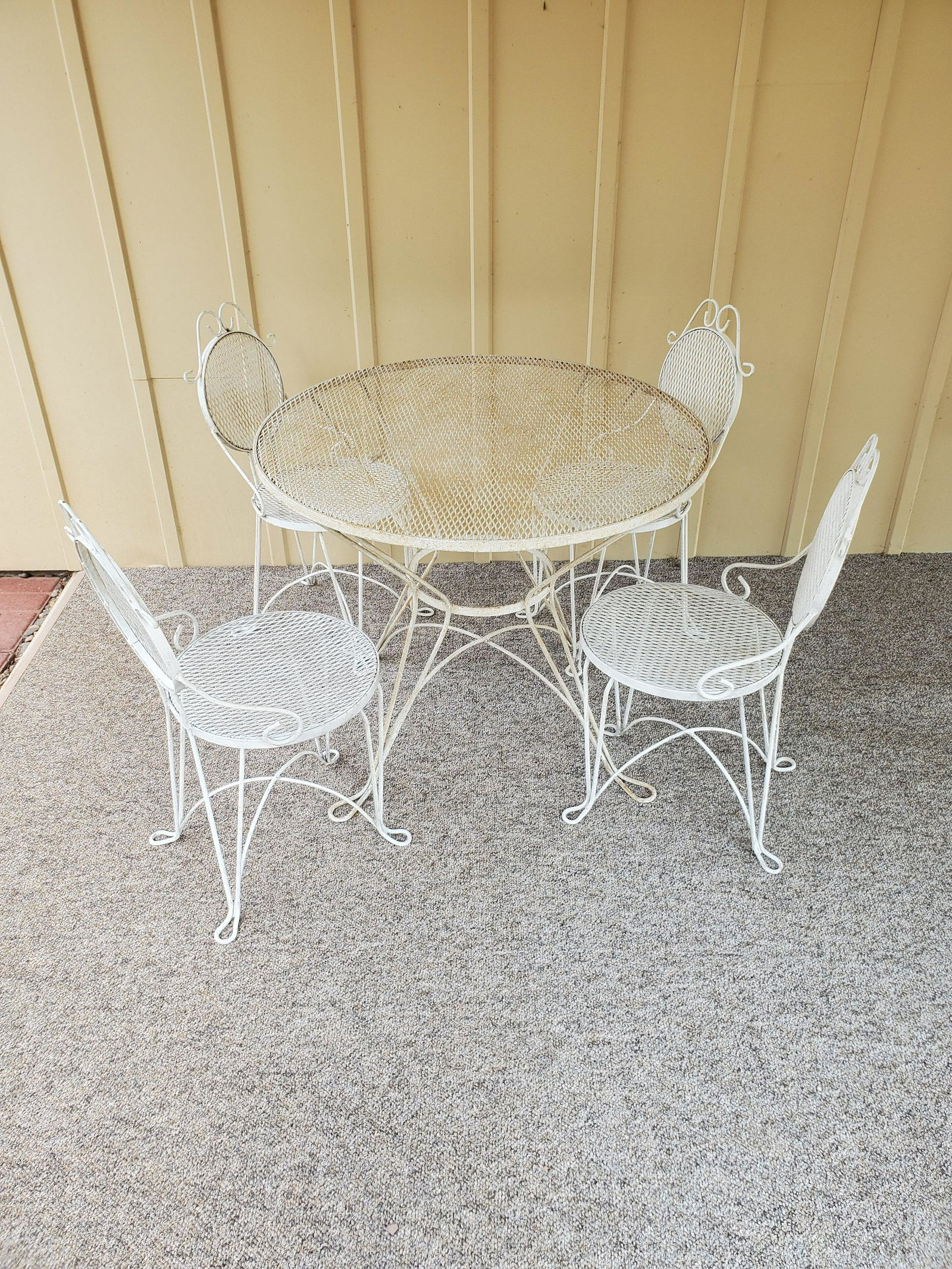 Outdoor Metal Table and 4 Chairs: Table 35" wide X 28 1/2" high. Chairs 16" wide X 18 1/4" deep X 32 1/2" high. Some rusting. IMPORTANT: Before bidding, please read the terms and conditions below. When you registered for the auction y