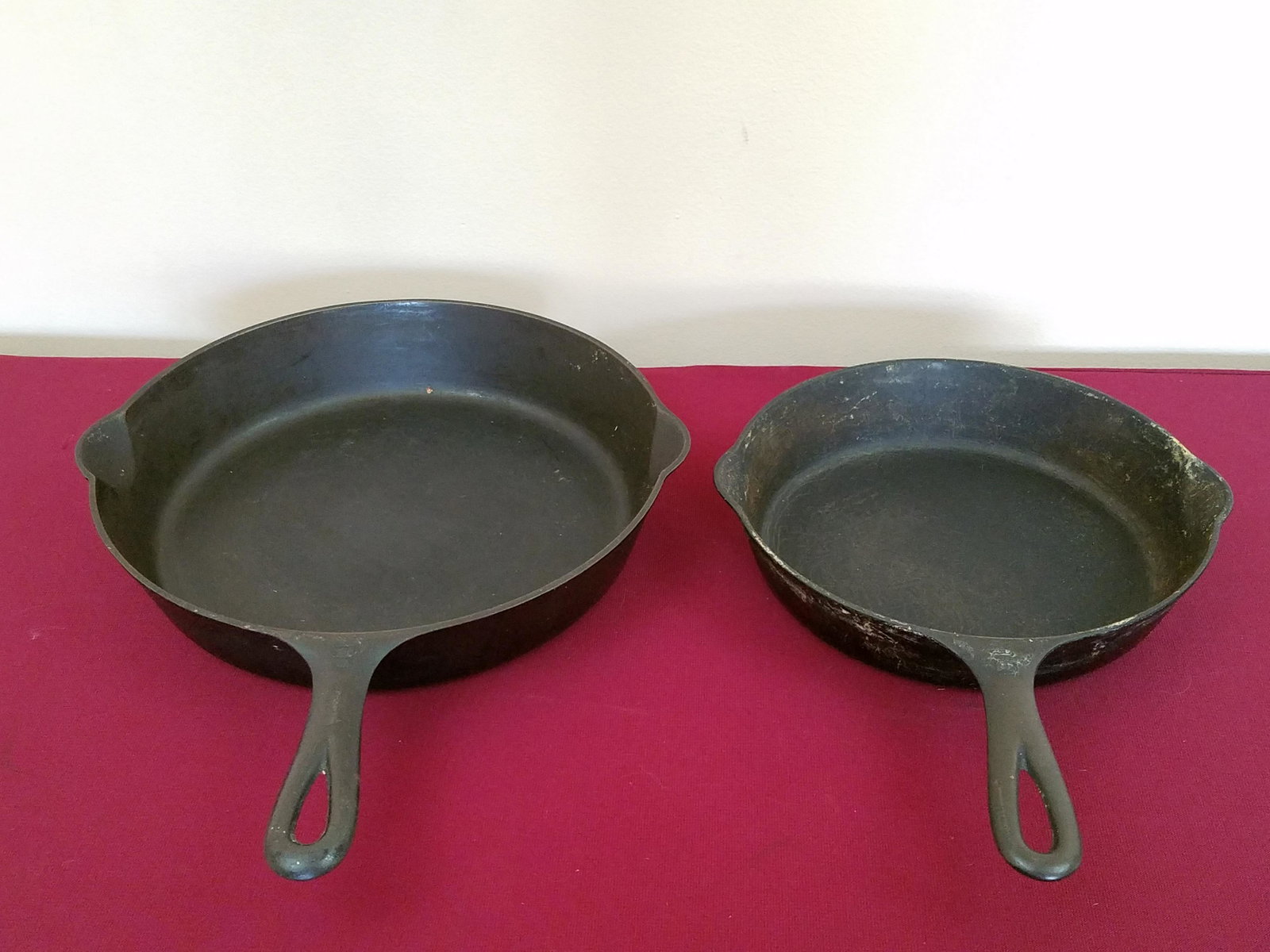 2 Griswold Skillets: Size 6 and 9. Some surface wear. IMPORTANT: Before bidding, please read the terms and conditions below. When you registered for the auction you agreed to these terms and will be required to comply wit