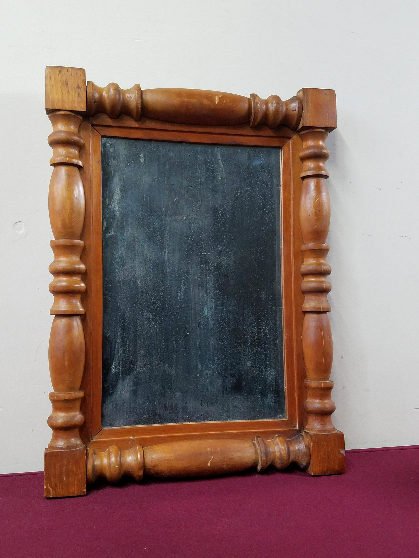 Antique Wall Mirror: Overall with frame 24" high x 18" wide. Spotting to glass. IMPORTANT: Before bidding, please read the terms and conditions below. When you registered for the auction you agreed to these terms and will