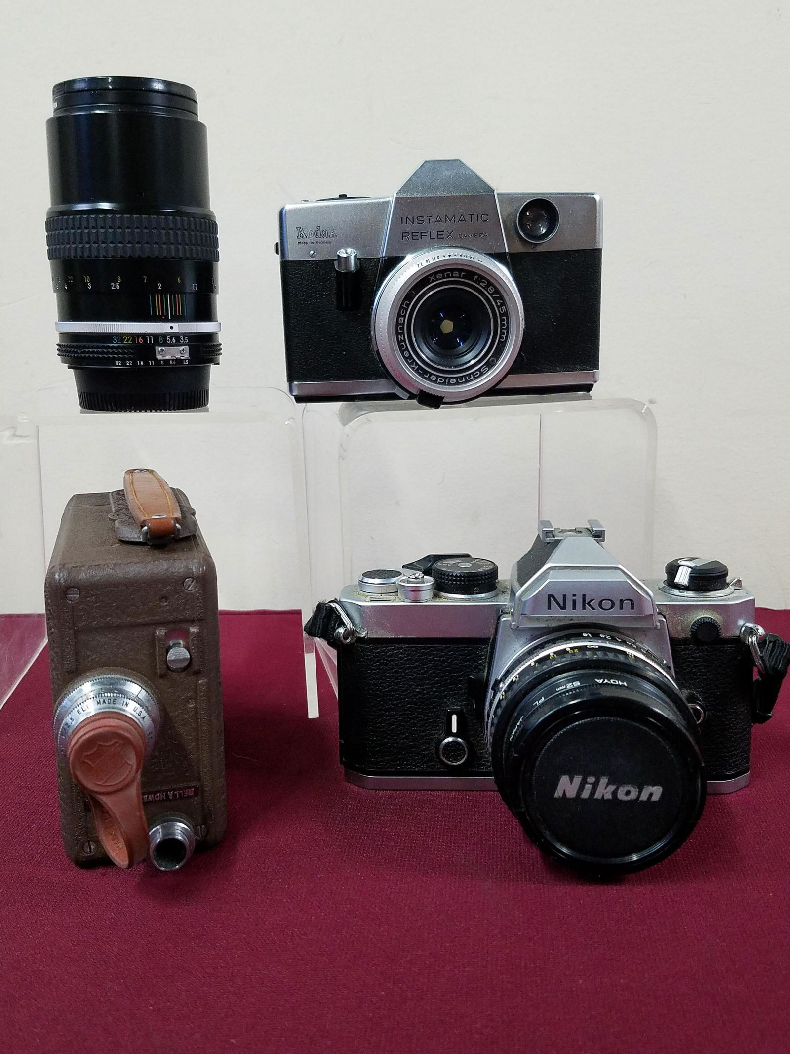 3 Cameras and Lens includes Nikon: Includes Nikon HOYA camera, Instamtic Reflex camera, Nikon 52 mm lens and a Bell and Howell camcorder. IMPORTANT: Before bidding, please read the terms and conditions below. When you registered for th