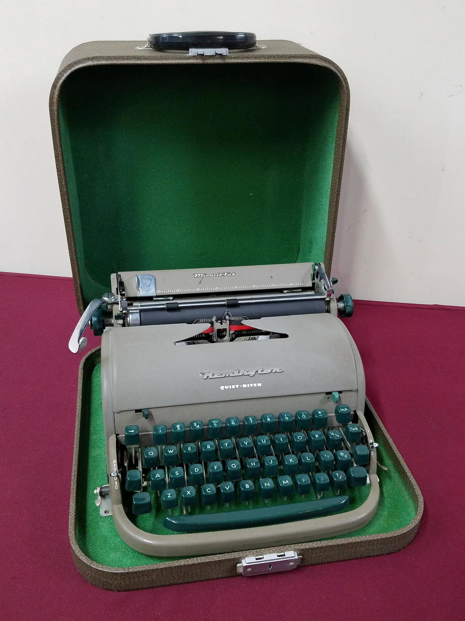 Remington Quiet-Riter Typewriter: Case: 14" wide x 15-1/4" deep x 7" high. IMPORTANT: Before bidding, please read the terms and conditions below. When you registered for the auction you agreed to these terms and will be required to co