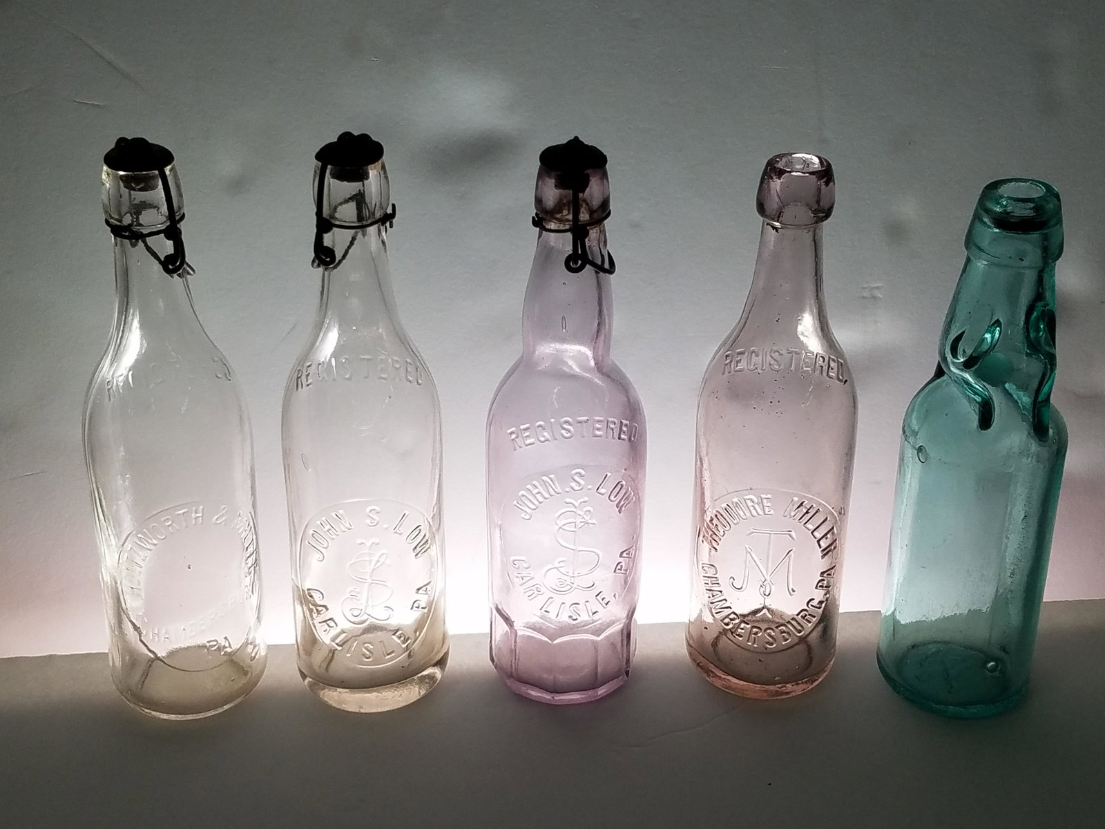 5 Soda Bottles: 9" to 10" high. IMPORTANT: Before bidding, please read the terms and conditions below. When you registered for the auction you agreed to these terms and will be required to comply with them.