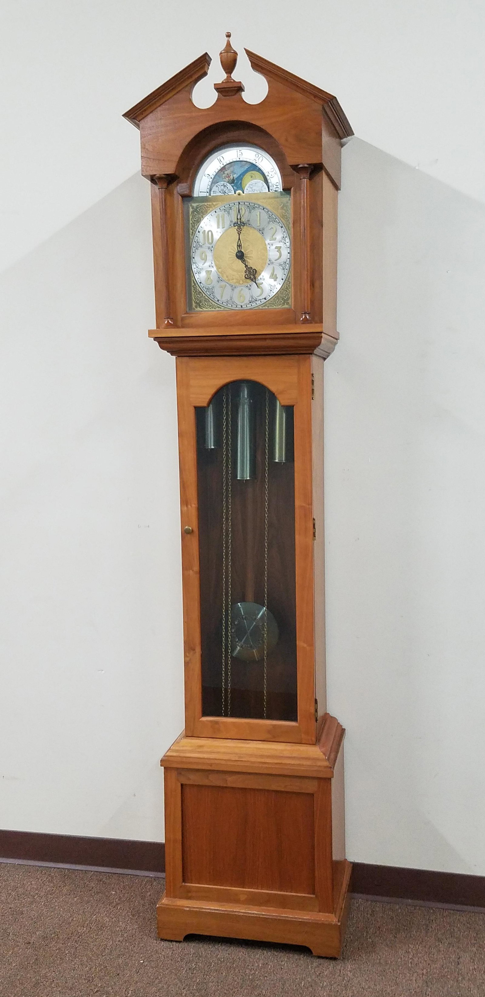 Western Germany Tall Case Clock: 18-1/2" wide x 11-1/4" deep x 86" high. Starts and Stops. Crack in glass door. IMPORTANT: Before bidding, please read the terms and conditions below. When you registered for the auction you agreed to 