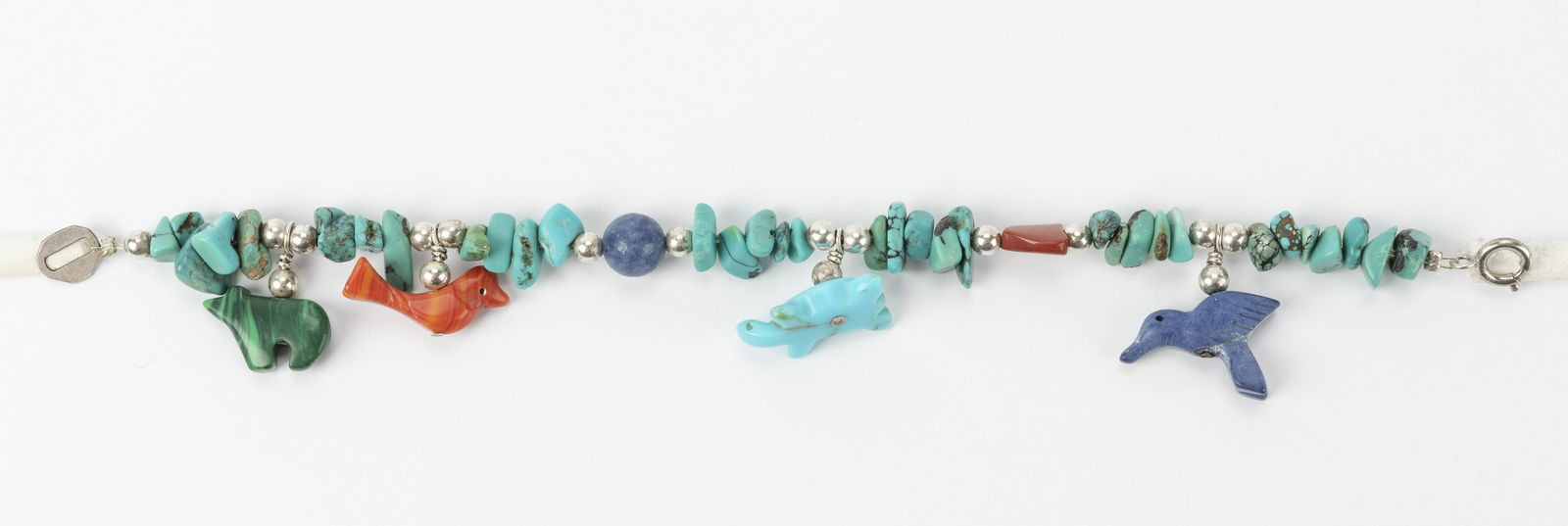 Sterling and Turquoise Fetish Bracelet: Includes coral, lapis, and malachite. Marked "Ster". 7-1/2" long. IMPORTANT: Before bidding, please read the terms and conditions below. When you registered for the auction you agreed to these terms a