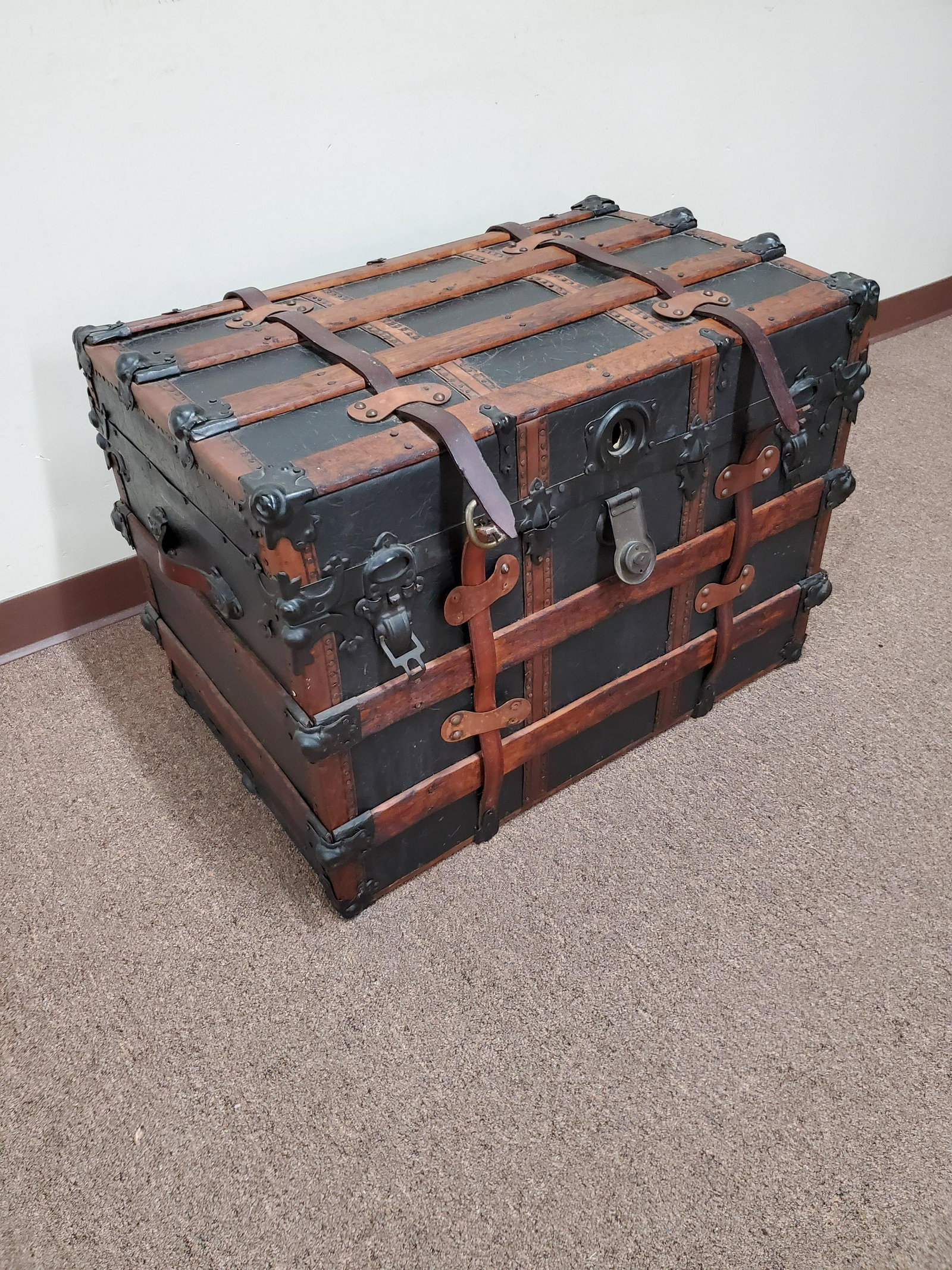 Steamer Trunk: 31" wide X 21" deep X 22" high. Some tacks are missing and one of the buckles are missing. IMPORTANT: Before bidding, please read the terms and conditions below. When you registered for the auction yo