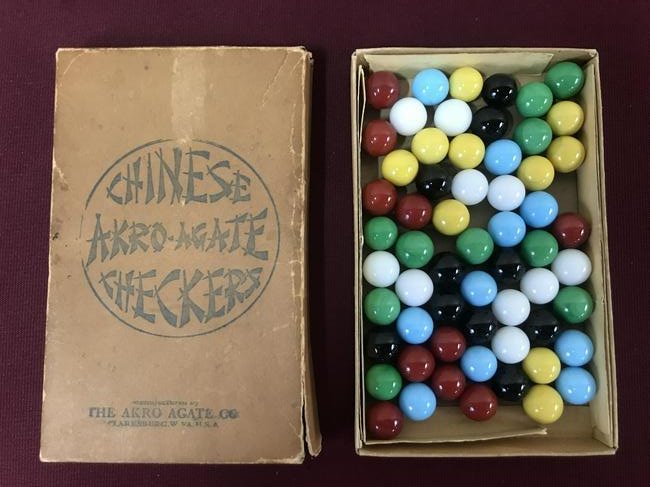 Akro Agate Chinese Checker Marbles in OB: All 60 marbles present. Box with even overall toning and minor separation at corners. Box 6" x 3-3/4". IMPORTANT: Before bidding, please read the terms and conditions below. When you registered for th