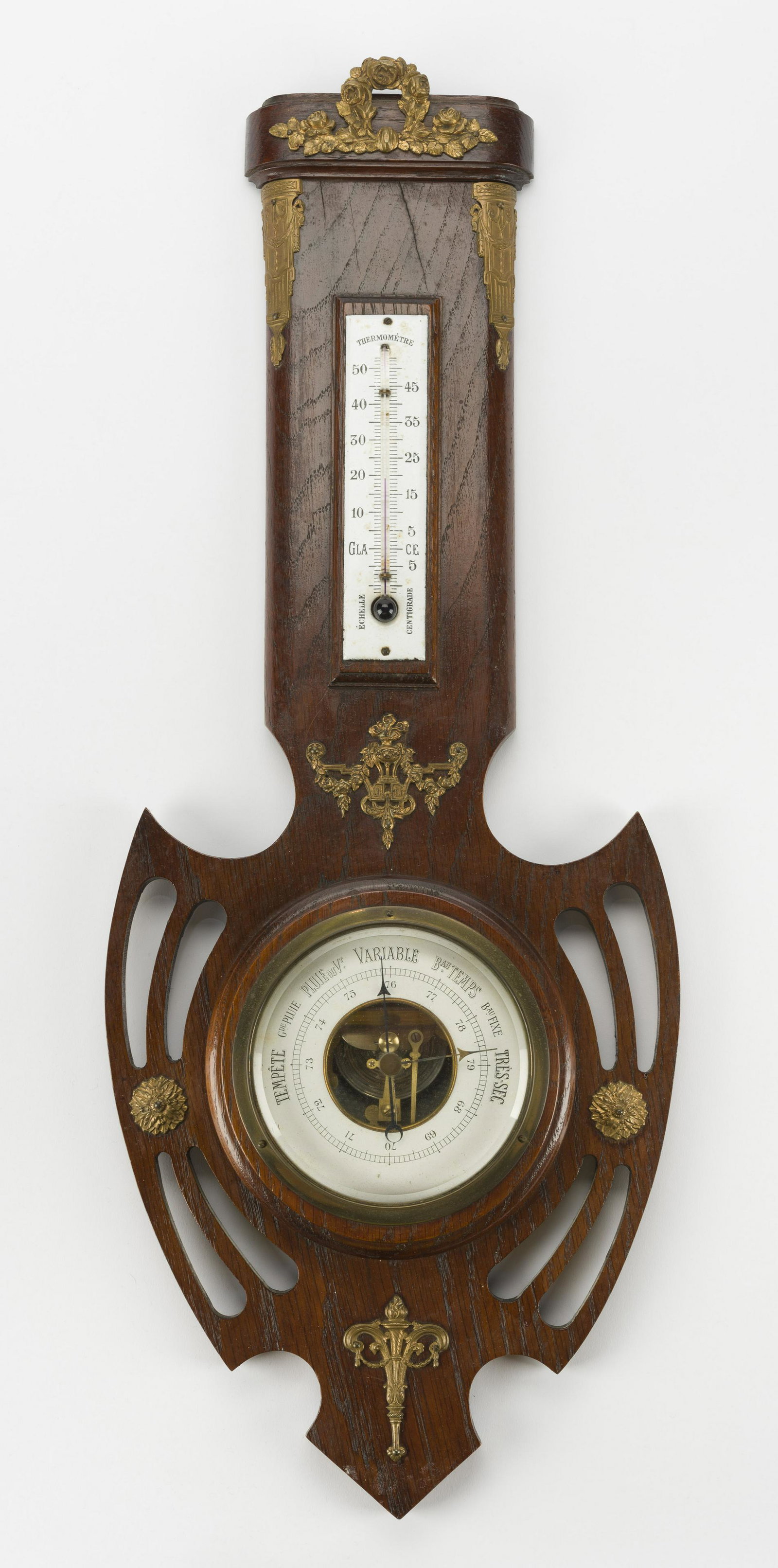 Clairetta Empire Style Barometer: Mahogany barometer/thermometer with brass mounts in Empire style. 24-1/2" long x 9-3/4" wide. IMPORTANT: Before bidding, please read the terms and conditions below. When you registered for the auction