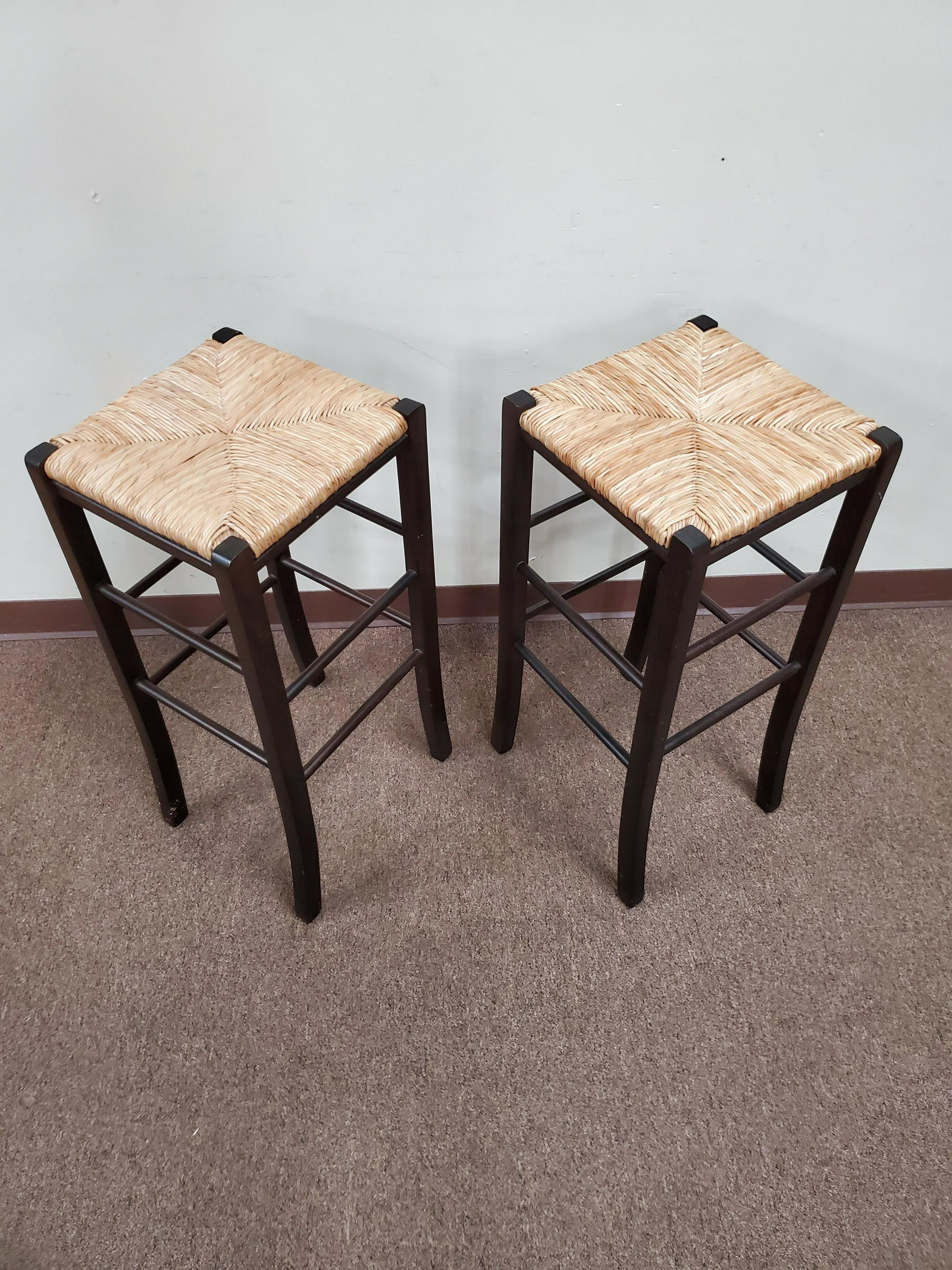 Pair of Rush Seated Stools: 13 1/2" wide X 13" deep X 30" high. IMPORTANT: Before bidding, please read the terms and conditions below. When you registered for the auction you agreed to these terms and will be required to comply 