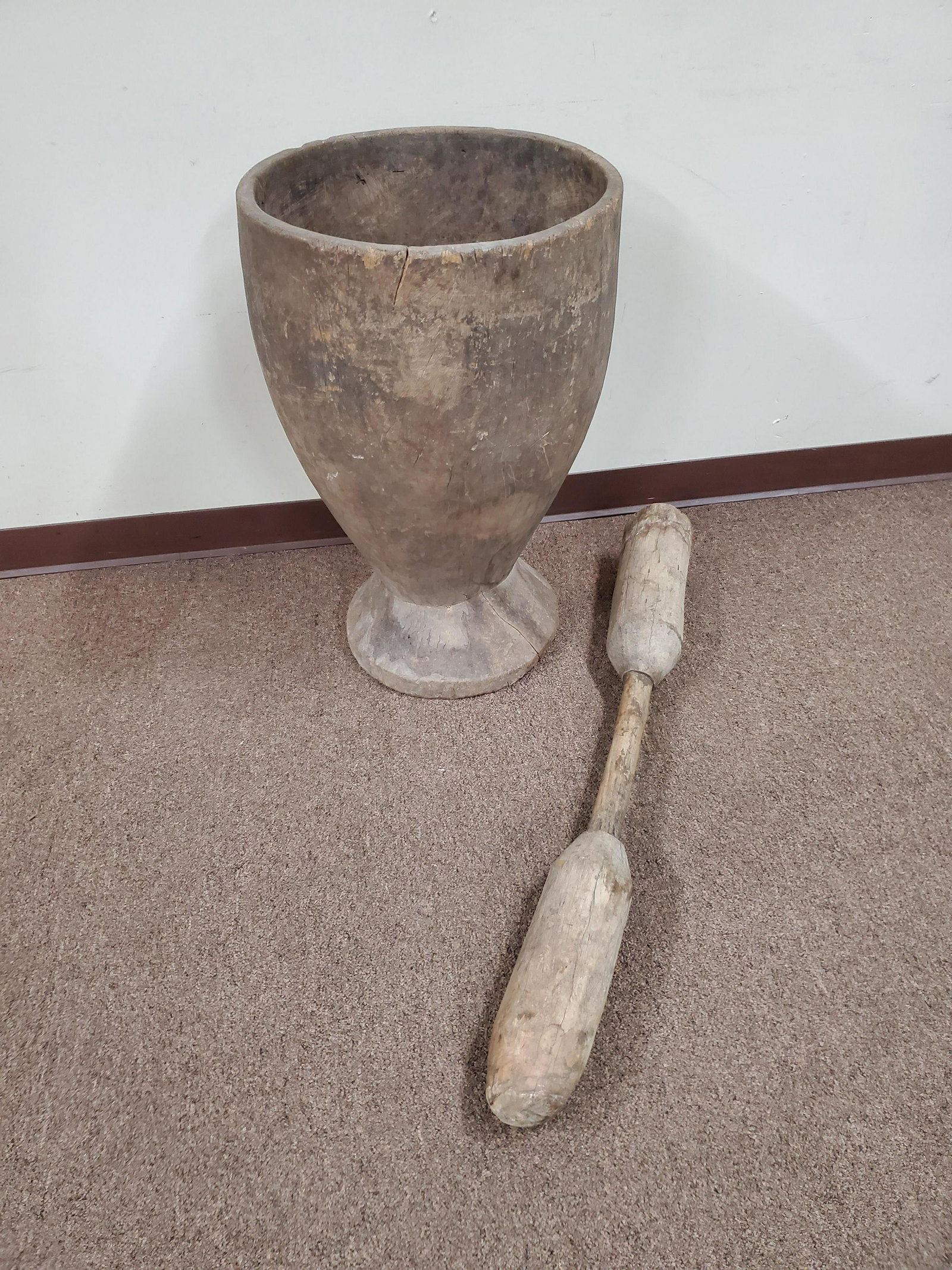 29" Ethnographic Mortar and Pestle for Pounding Grain: Mortar 18 1/4" wide X 29 1/2" high. Pestle 4 3/4" wide X 42 1/2" long. IMPORTANT: Before bidding, please read the terms and conditions below. When you registered for the auction you agreed to these te