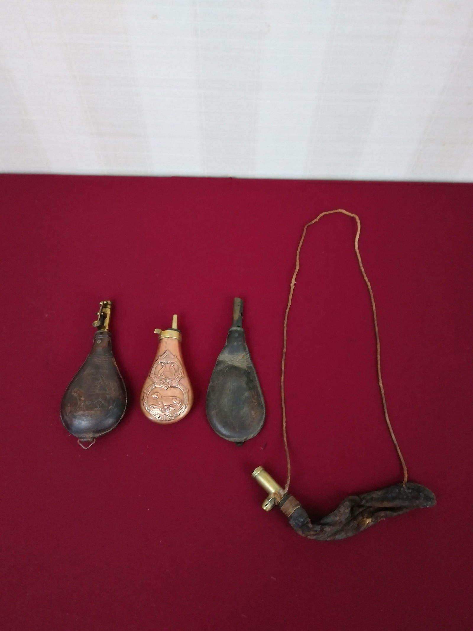 4 Shot Flasks: Includes copper and leather. Largest 8-1/2". IMPORTANT: Before bidding, please read the terms and conditions below. When you registered for the auction you agreed to these terms and will be required t