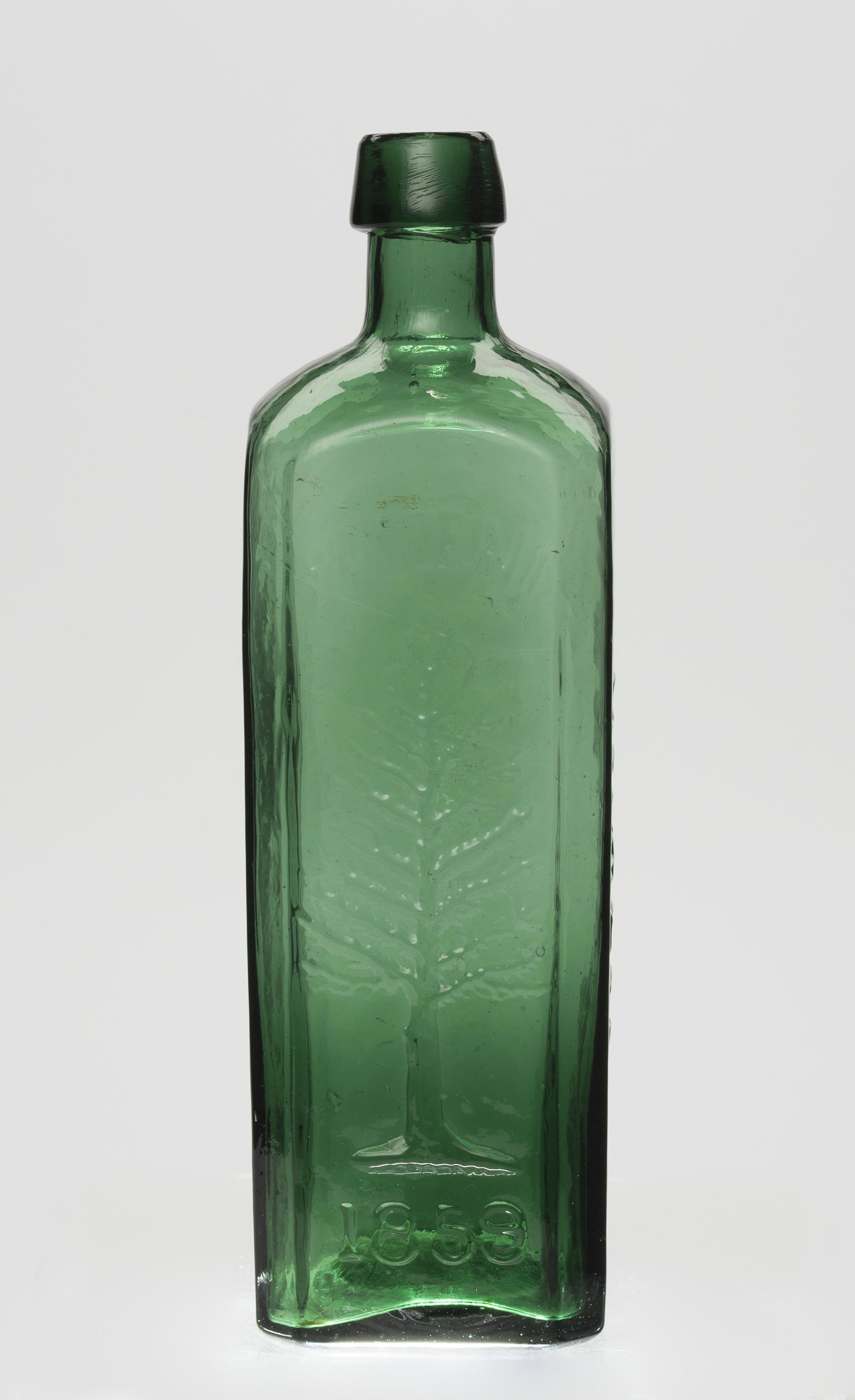 Wishart Pine Tree Medical Bottle: 9-1/2" high. IMPORTANT: Before bidding, please read the terms and conditions below. When you registered for the auction you agreed to these terms and will be required to comply with them.