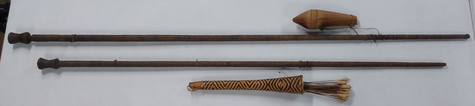 2 Ethnographic Blowguns with Darts and Quiver: 81" and 92-1/2" long. IMPORTANT: Before bidding, please read the terms and conditions below. When you registered for the auction you agreed to these terms and will be required to comply with them.