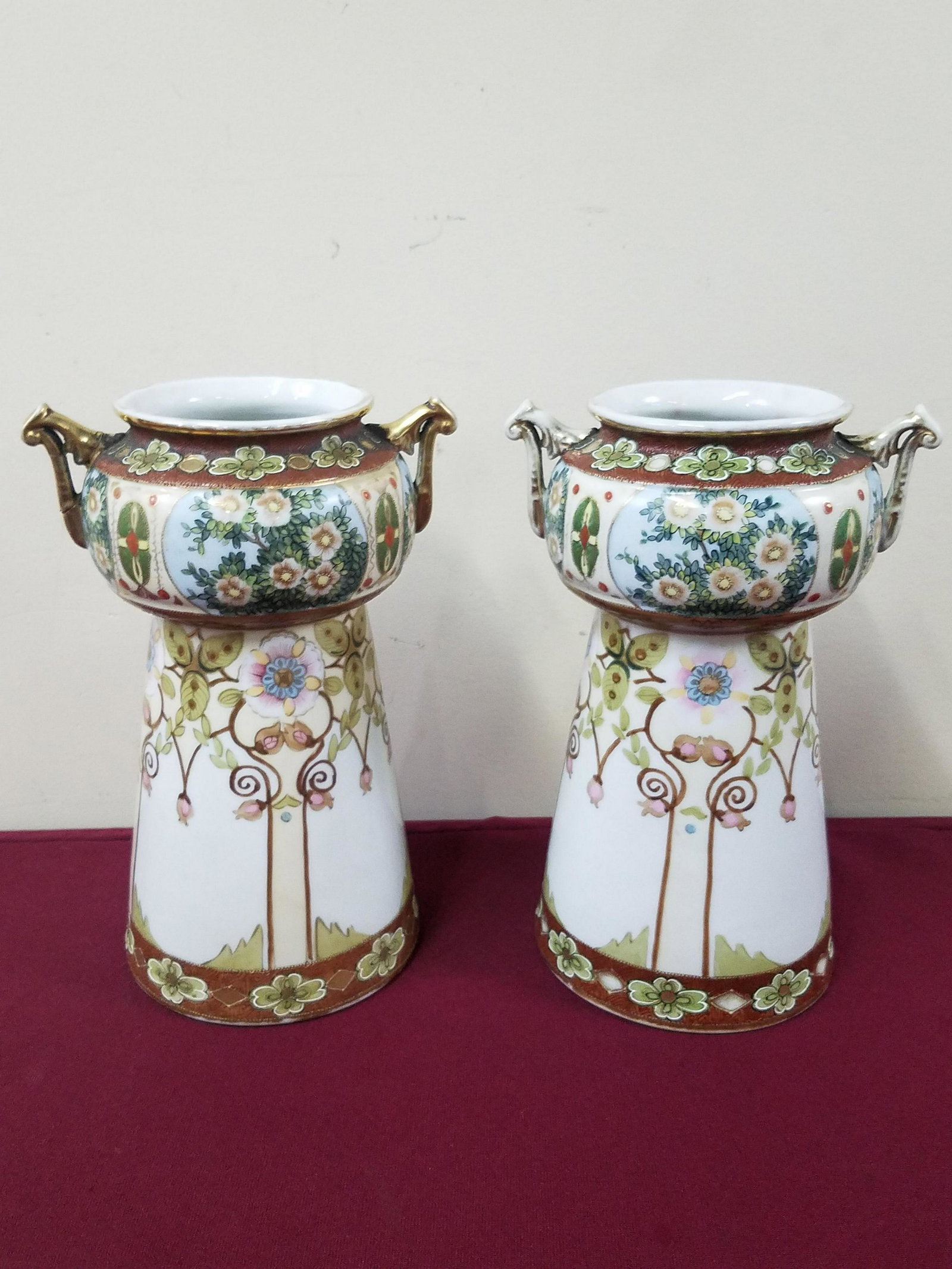 2 Nippon Vases: Each 5-3/4" diameter x 11" high. One with repaired handle. IMPORTANT: Before bidding, please read the terms and conditions below. When you registered for the auction you agreed to these terms and will