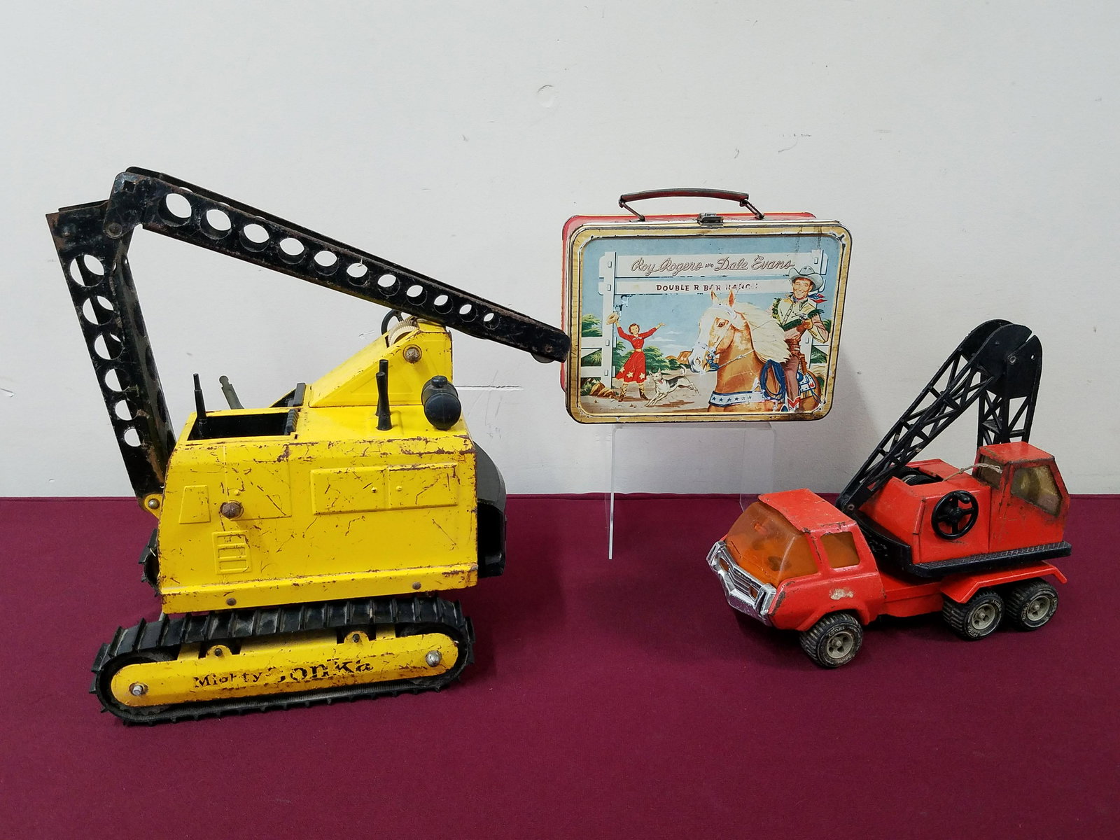 2 Tonka Trucks and Roy Rodgers Lunch Box: Includes Roy Rogers and Dale Evans double Bar Ranch lunch box. No thermos. Both Tonka trucks with paint losses and rust. IMPORTANT: Before bidding, please read the terms and conditions below. When you