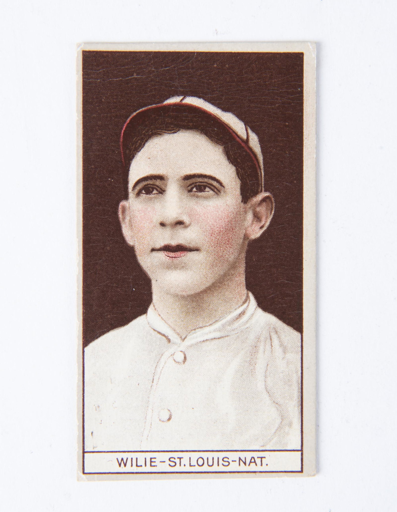 T207 1912 Brown Background Ernest Wilie: VG IMPORTANT: Before bidding, please read the terms and conditions below. When you registered for the auction you agreed to these terms and will be required to comply with them.