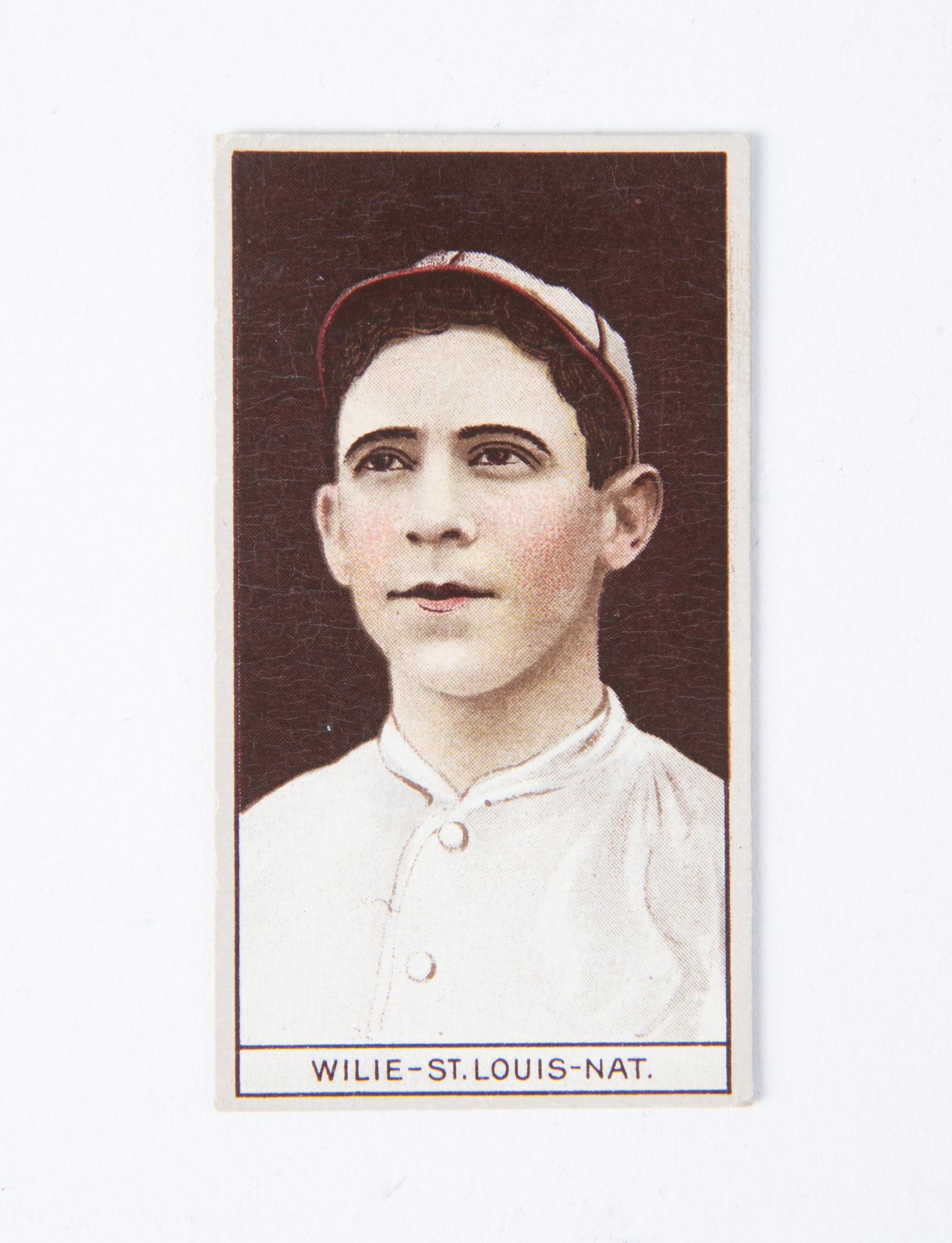 T207 1912 Brown Background Ernest Wilie: VG-EX IMPORTANT: Before bidding, please read the terms and conditions below. When you registered for the auction you agreed to these terms and will be required to comply with them.