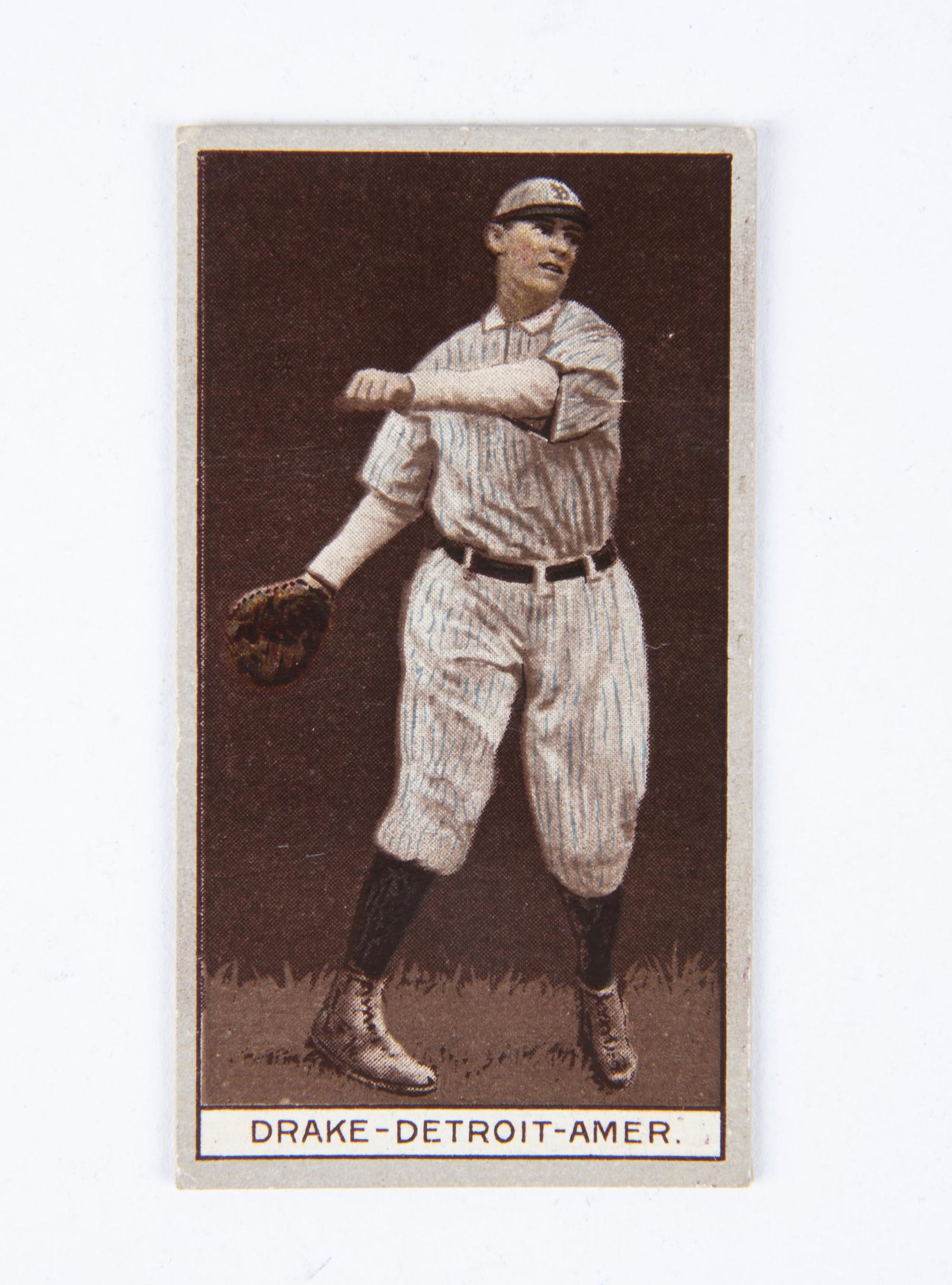 T207 1912 Brown Background Del Drake: VG-EX IMPORTANT: Before bidding, please read the terms and conditions below. When you registered for the auction you agreed to these terms and will be required to comply with them.
