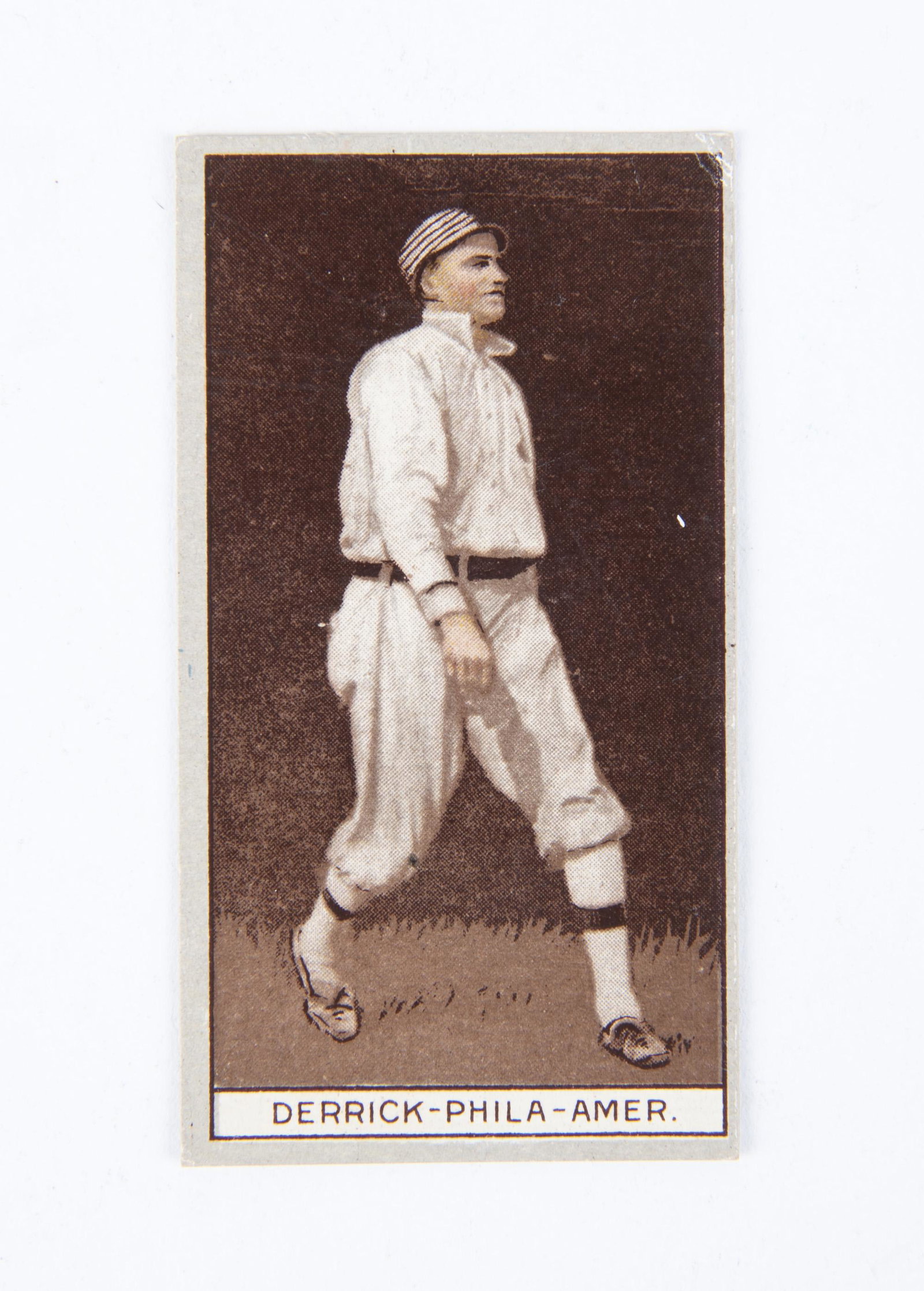 T207 1912 Brown Background Claude Derrick: VG-EX IMPORTANT: Before bidding, please read the terms and conditions below. When you registered for the auction you agreed to these terms and will be required to comply with them.