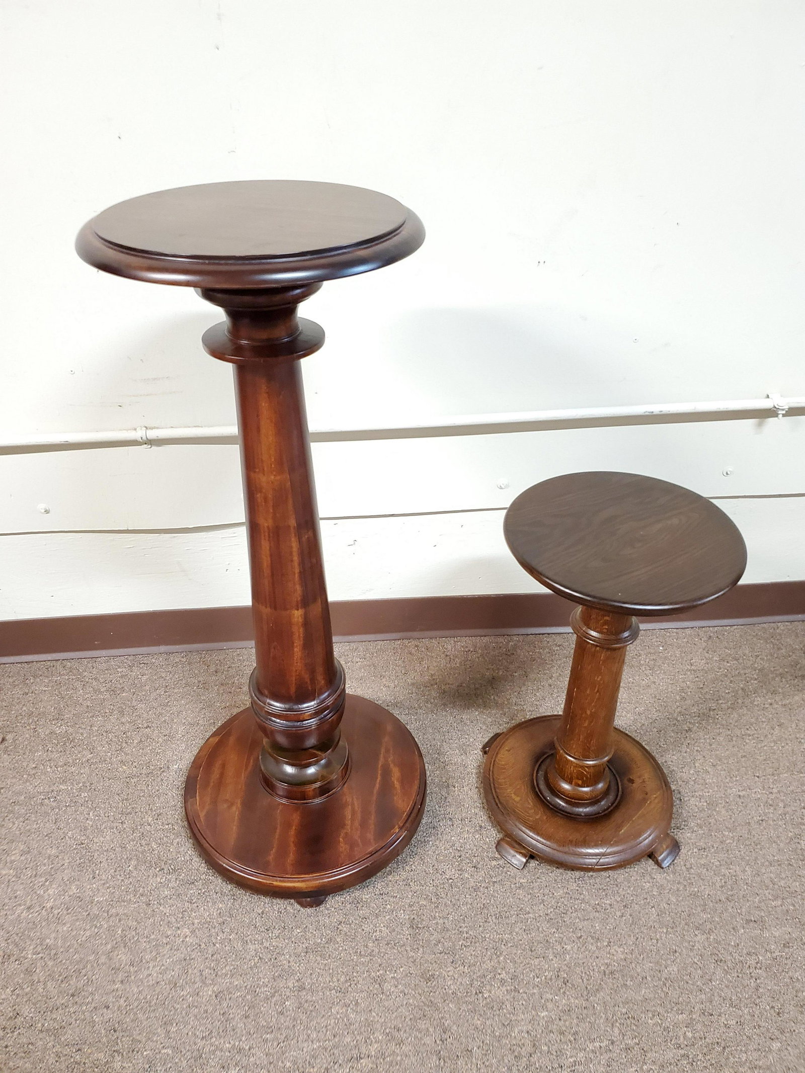 2 Wood Plant Stands: Tall 15 1/4" wide X 36 1/4" high. Short 12" wide X 20 3/4" high. Small one has split in base. IMPORTANT: Before bidding, please read the terms and conditions below. When you registered for the auction
