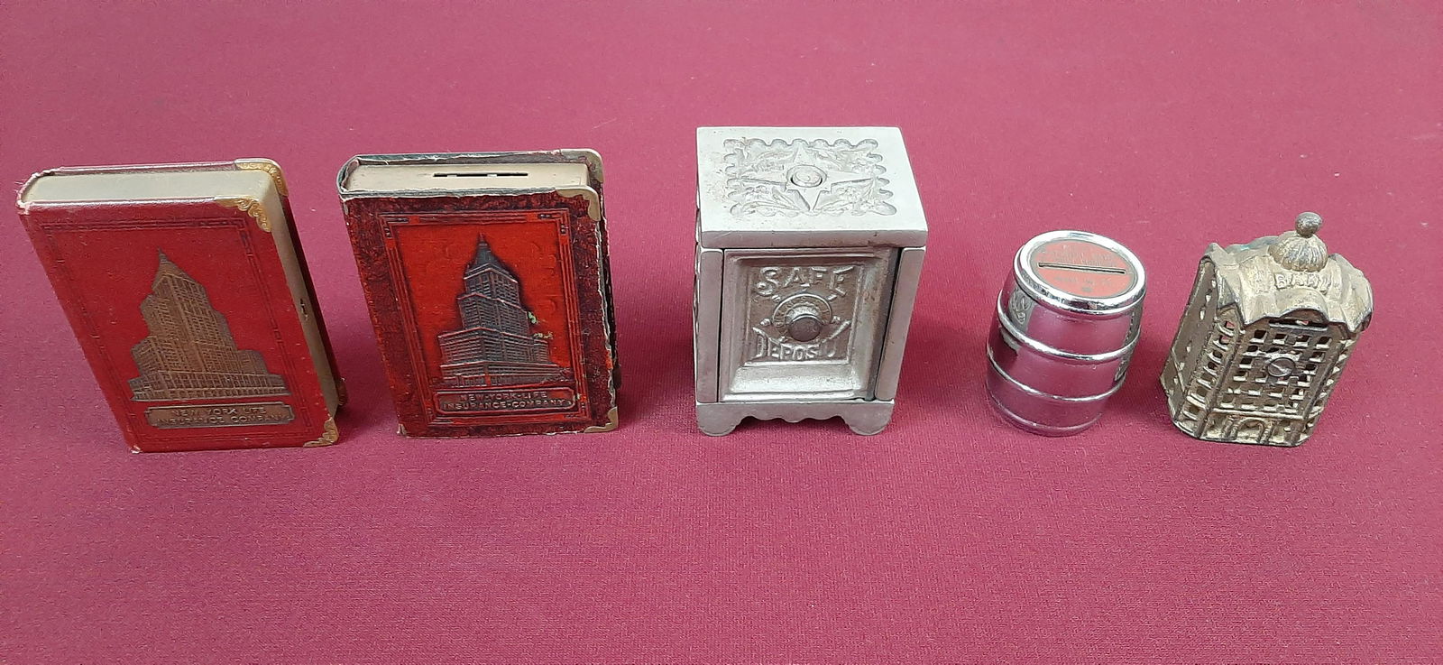 5 Banks: Includes New York Life Insurance Company and Mt. Joy First National Bank and Trust Co. 2 1/4" to 3 1/2" wide X 1" to 2 1/4" deep X 2 3/4" to 4 1/2" high. IMPORTANT: Before bidding, please read the ter