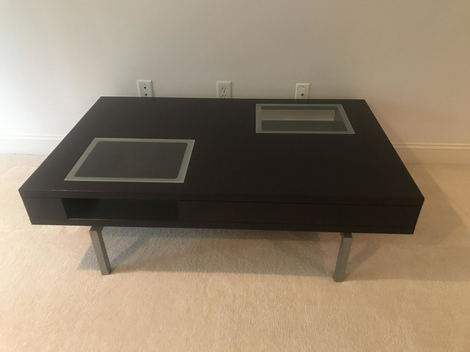 Wood and Glass Coffee Table: Brushed aluminum legs. 52” wide x 33” deep x 15-1/2” high. IMPORTANT: Before bidding, please read the terms and conditions below. When you registered for the auction you agreed to these terms an