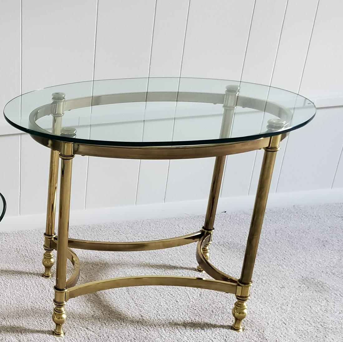 Brass and Glass Side Table: 28" wide X 21 1/2" deep X 21 1/2" high. IMPORTANT: Before bidding, please read the terms and conditions below. When you registered for the auction you agreed to these terms and will be required to com