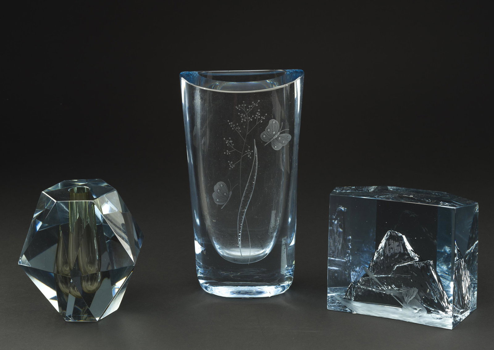 3 Pcs Blue Art Glass Signed Stromberg: Includes sculpture with etched Inuit paddler with mountain in background signed A. Stromberg, Rune Strand, and L. Borneson. Ranges from 5" high to 9-1/2" high. IMPORTANT: Before bidding, please read t
