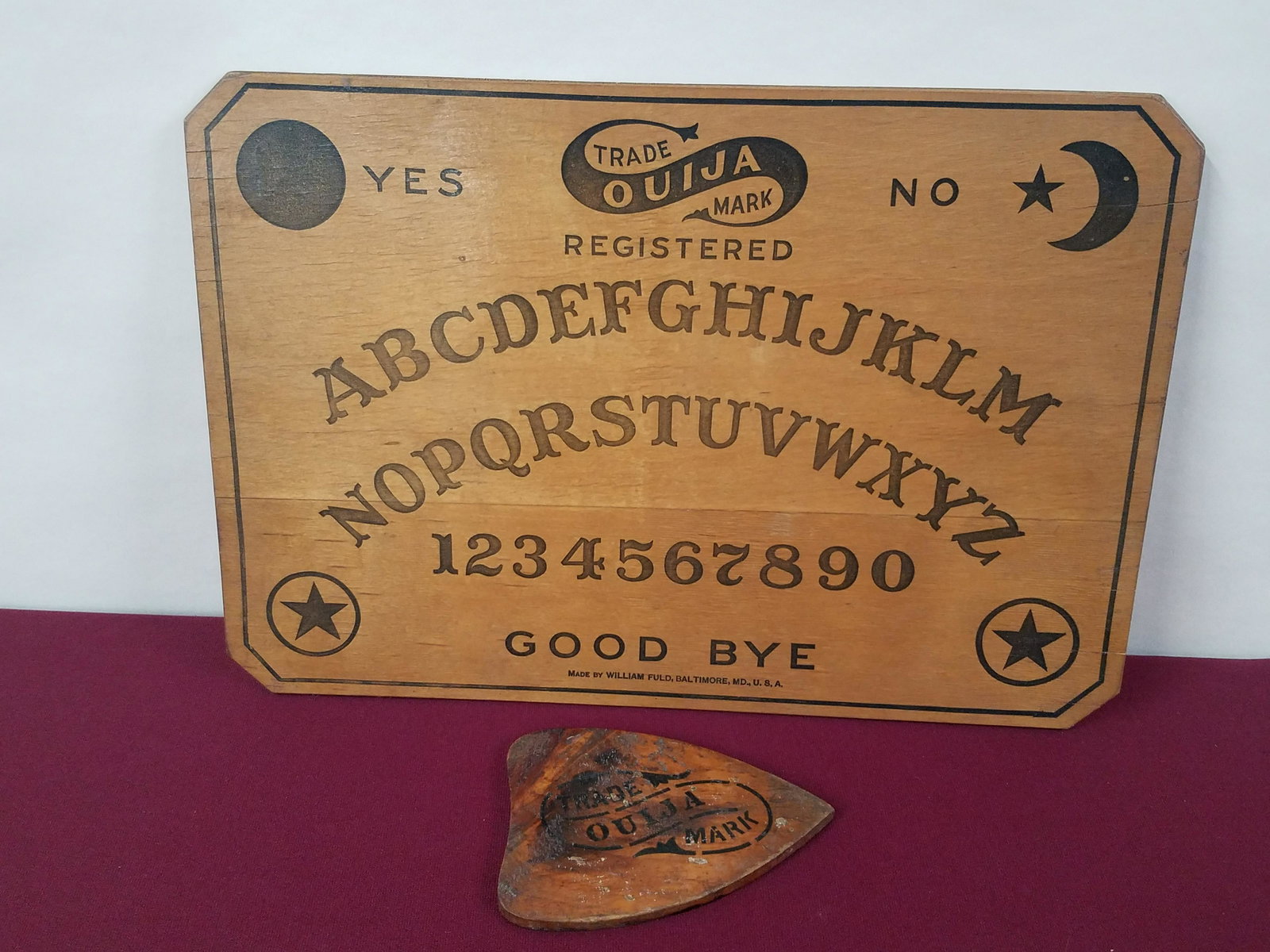 William Fuld Ouija Board: Baltimore, Maryland. Some minor splitting to wood. IMPORTANT: Before bidding, please read the terms and conditions below. When you registered for the auction you agreed to these terms and will be requ
