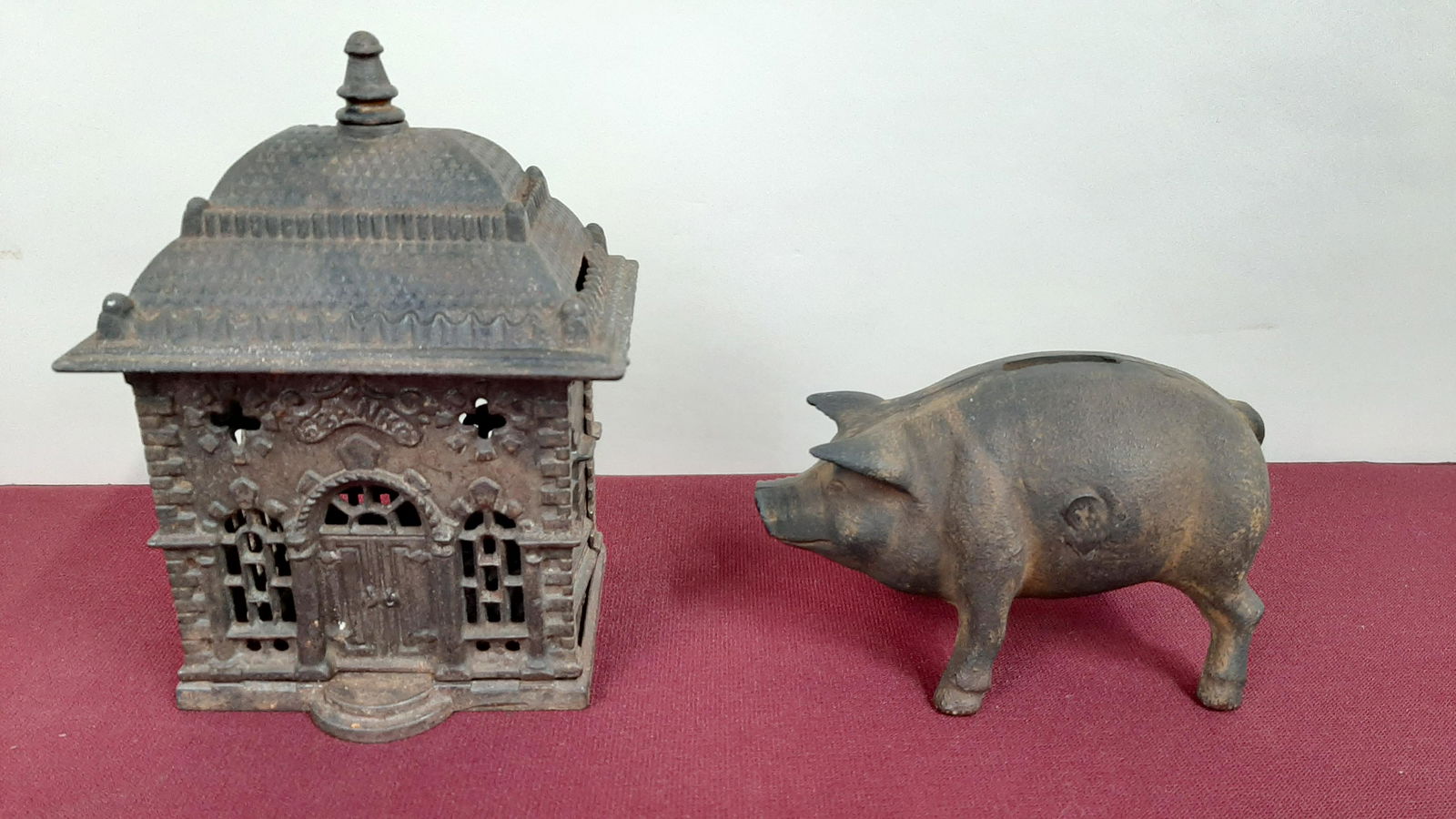 2 Cast Iron Still Banks: 4 1/2" to 5" wide X 3" to 6" high. IMPORTANT: Before bidding, please read the terms and conditions below. When you registered for the auction you agreed to these terms and will be required to comply w