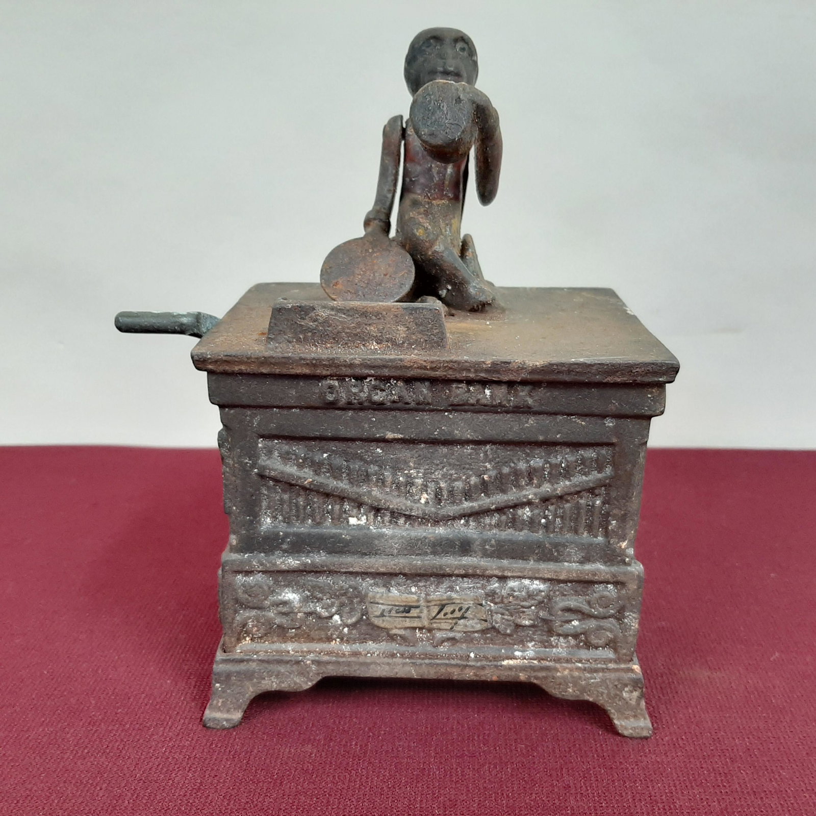 Organ Grinder Mechanical Bank: 4 1/2" wide X 2 3/4" deep X 6" high. Sold as is. IMPORTANT: Before bidding, please read the terms and conditions below. When you registered for the auction you agreed to these terms and will be requir