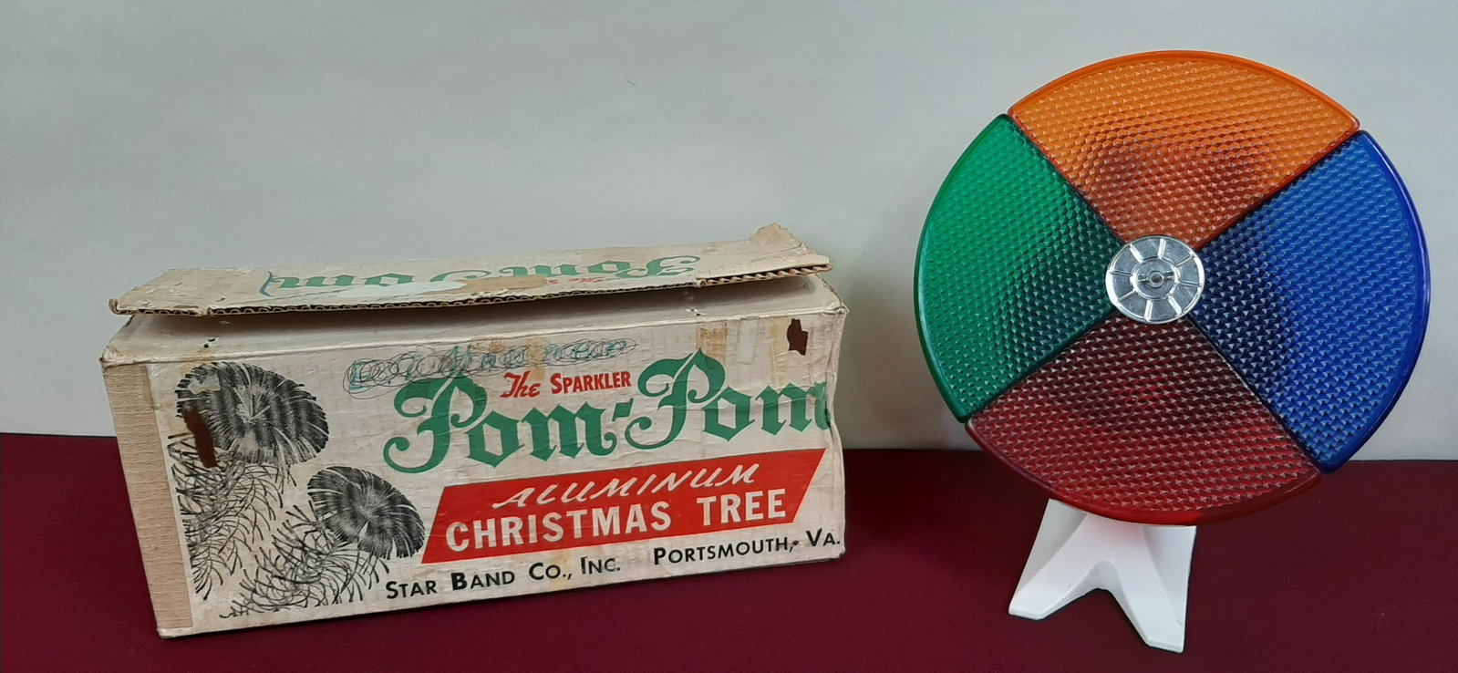 Aluminum Christmas Tree and Color Wheel Light: 4 ft. Sparkler Pom Pom made by Star Band Co., Inc. Item number M-434 E. Wheel: 11 1/2" diameter X 12 1/2" high. Working. IMPORTANT: Before bidding, please read the terms and conditions below. When you