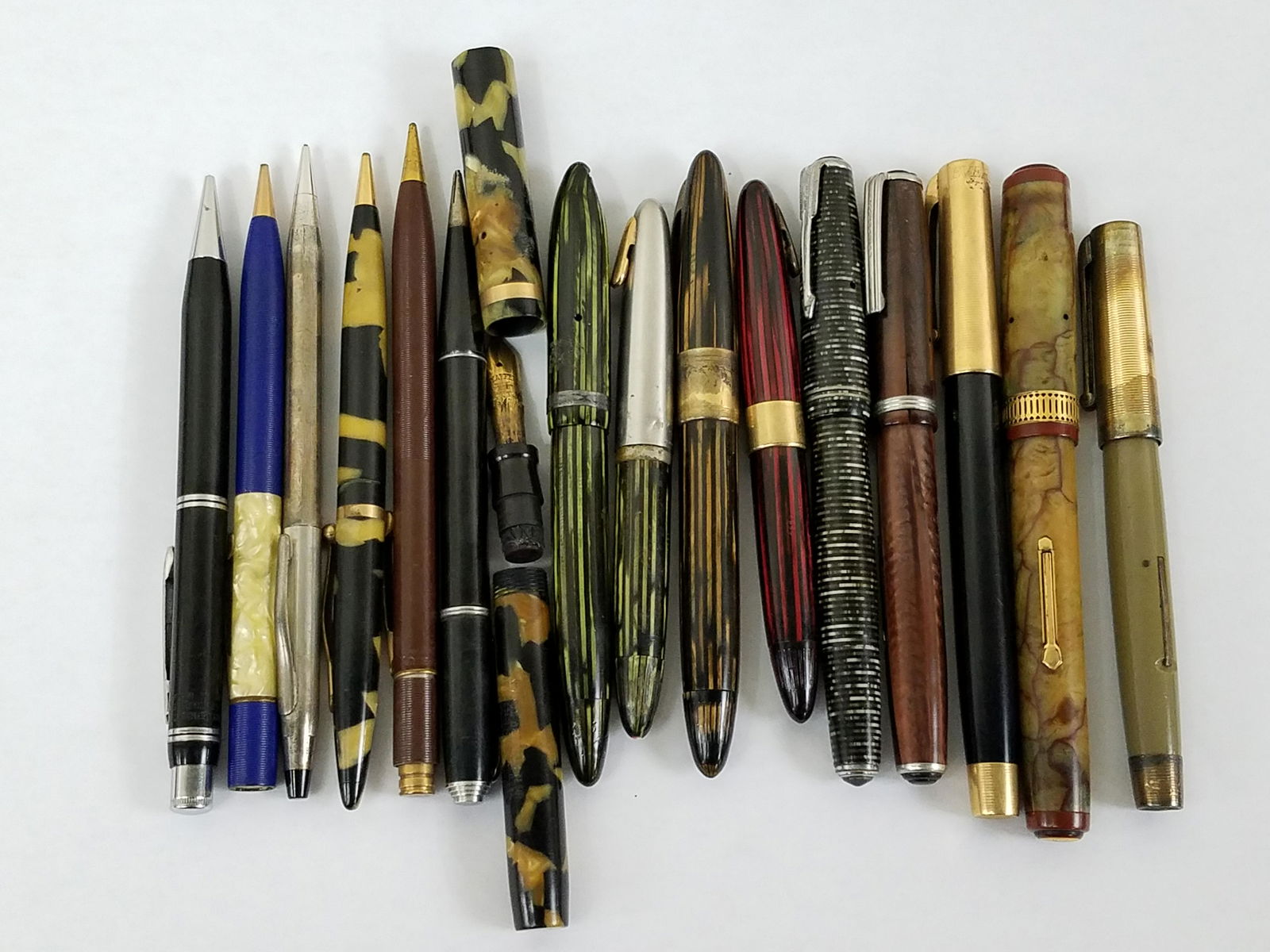 16 Pens and Pencils incl Sheaffer and Parker: Also includes Easterbrook (split in cap), Everlast ball point, Waterman. 3 Sheaffer pens with 14 K nibs. IMPORTANT: Before bidding, please read the terms and conditions below. When you registered for