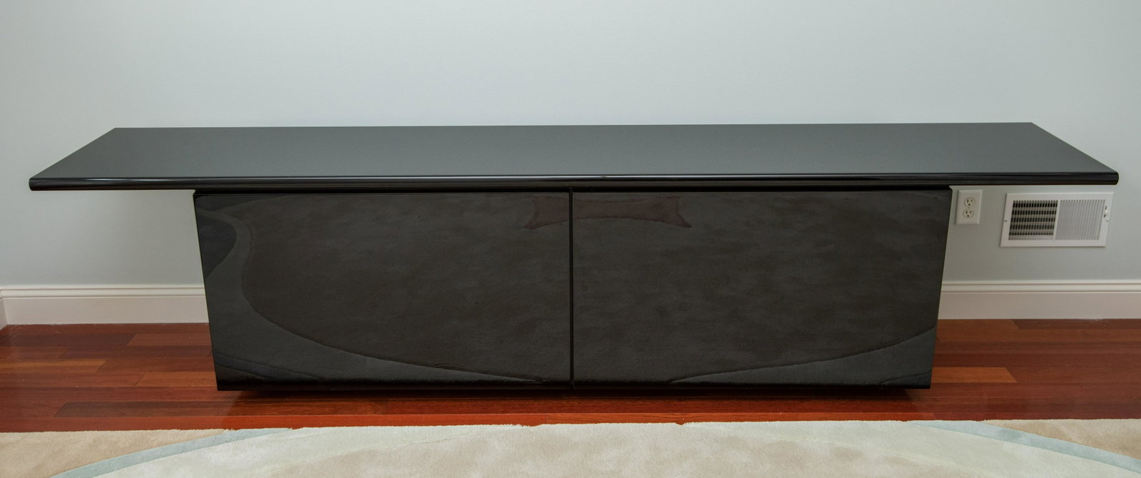 Modern Sideboard: Doors slide and swing open. Adjustable shelves. 110" long x 19" deep x 27 1/2" high. IMPORTANT: Before bidding, please read the terms and conditions below. When you registered for the auction you agre
