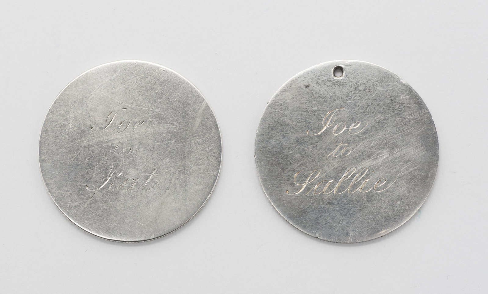2 19th Century Coin Pendant Tokens: Both marked "1841 March 22 1886". One engraved "Joe to Rat", one inscribed "Joe to Sallie". Both made from coins evidenced by reeding at sides.