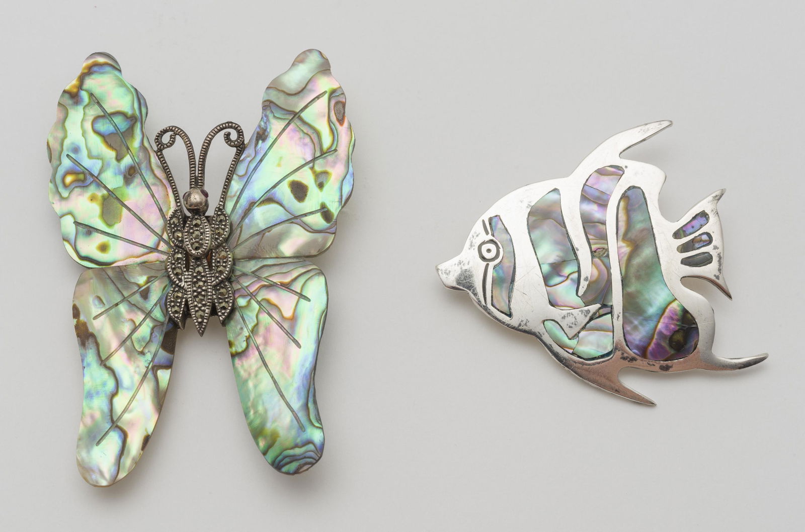 2 Sterling and Abalone Brooches: Fish 2" wide x 2" high; butterfly 2" wide x 3" high.