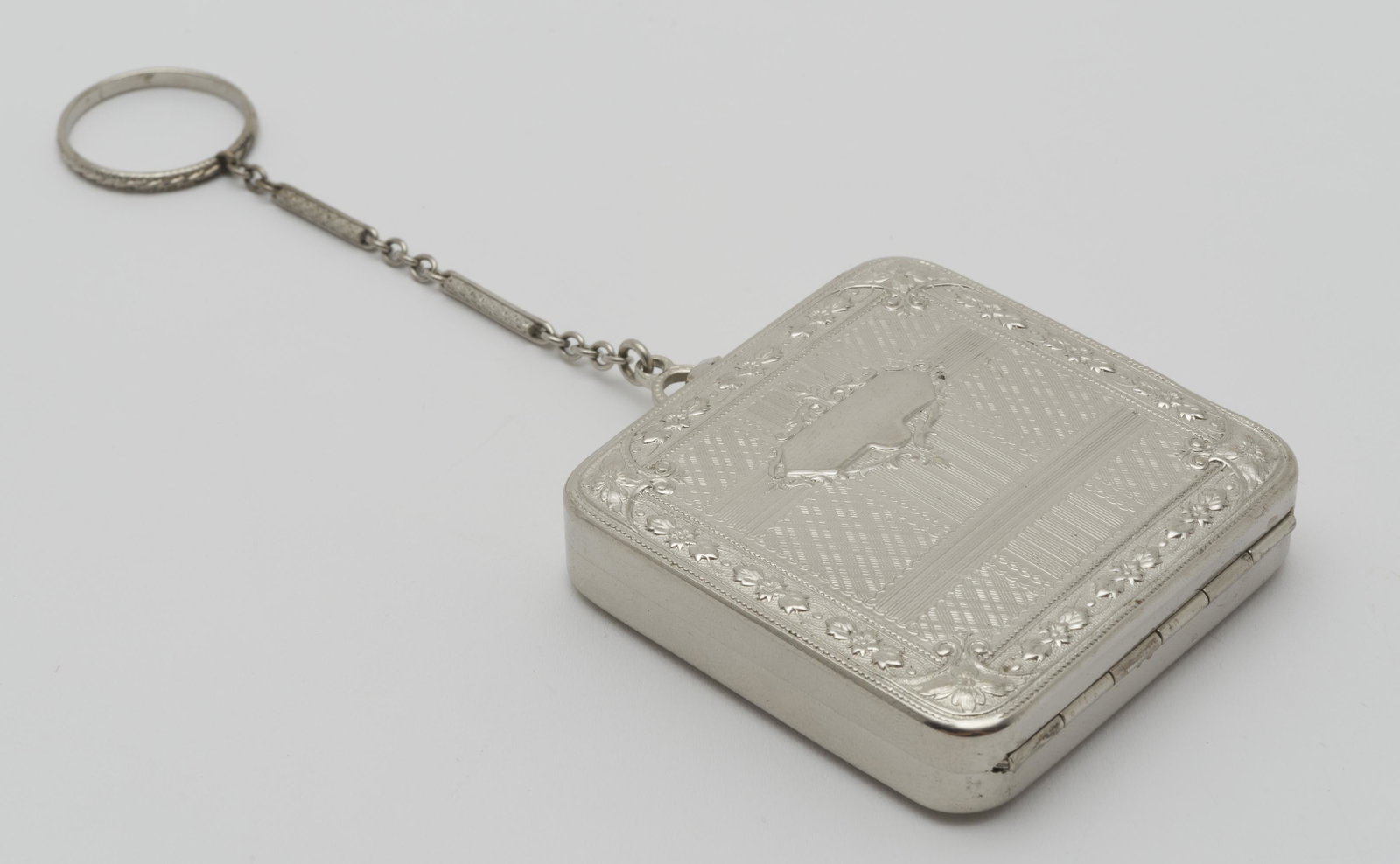 Vintage Silverplate Compact: 2-1/2" x 2-1/16" when closed. Chain 3-1/2" long.