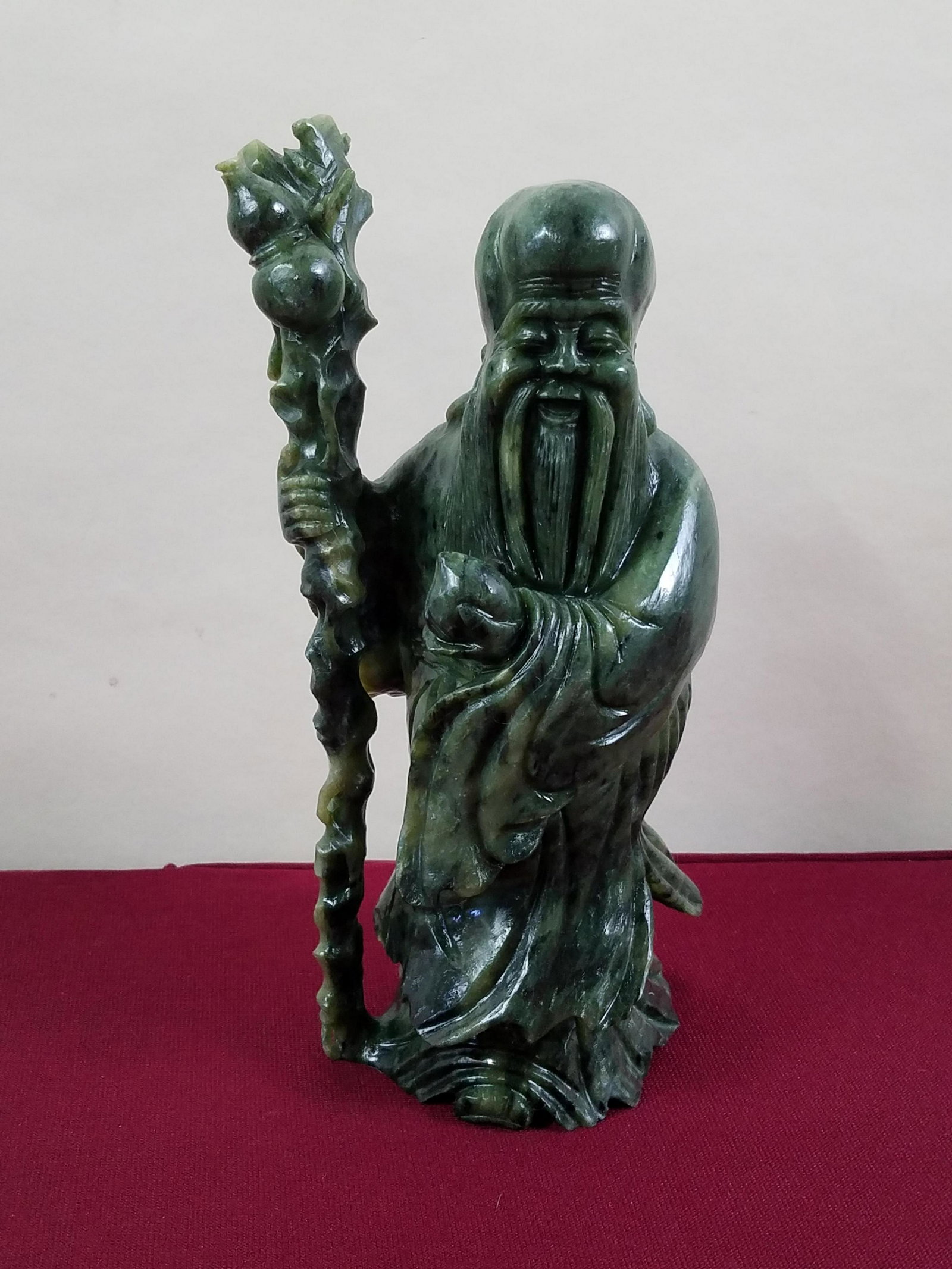 Chinese Jade Sculpture: 4-1/2" wide x 9" high. Loss to top of staff. IMPORTANT: Before bidding, please read the terms and conditions below. When you registered for the auction you agreed to these terms and will be required t
