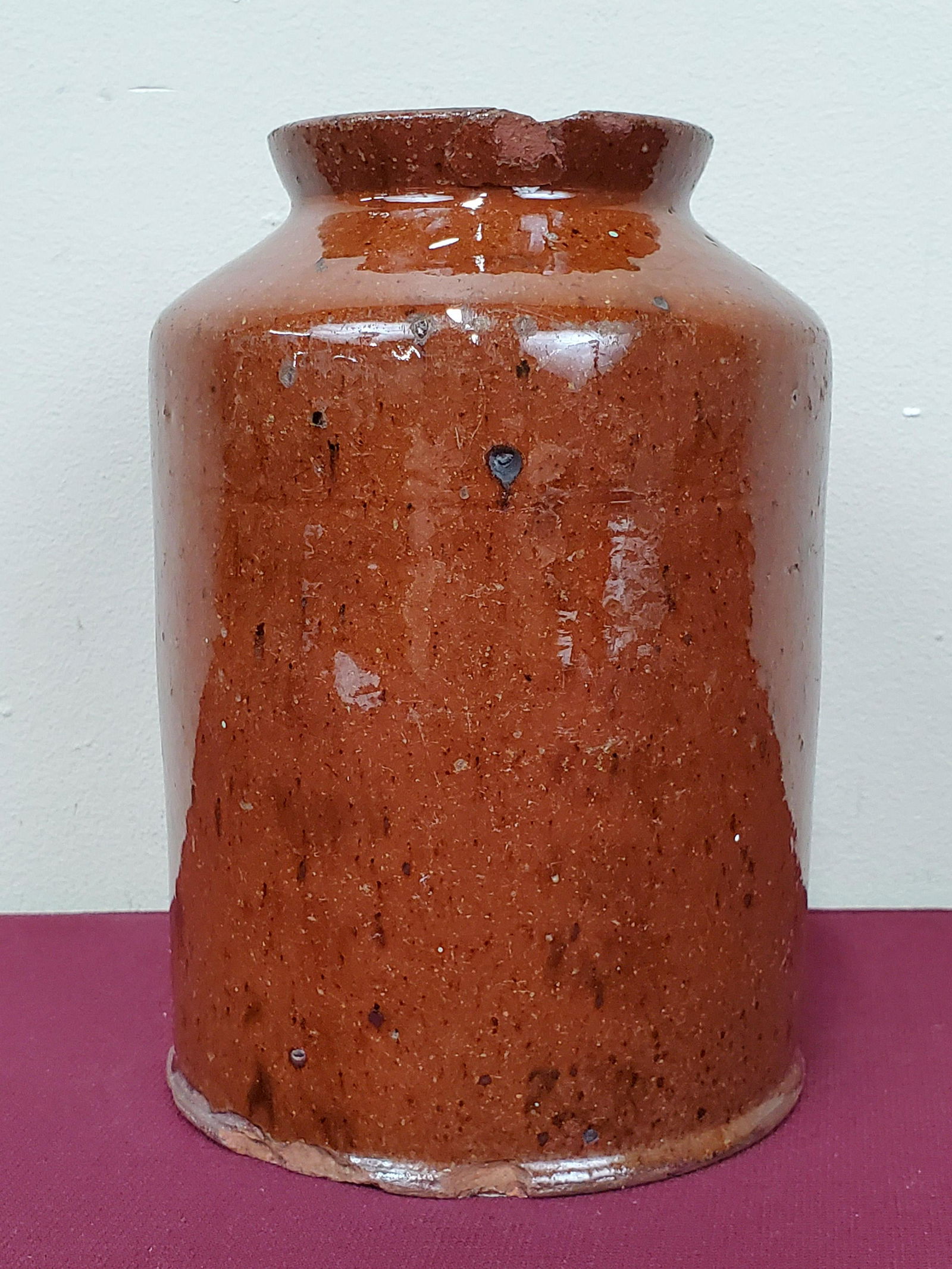 19th Century Redware Jar: 5" wide X 5" deep X 7" high. Has some chips. IMPORTANT: Before bidding, please read the terms and conditions below. When you registered for the auction you agreed to these terms and will be required t